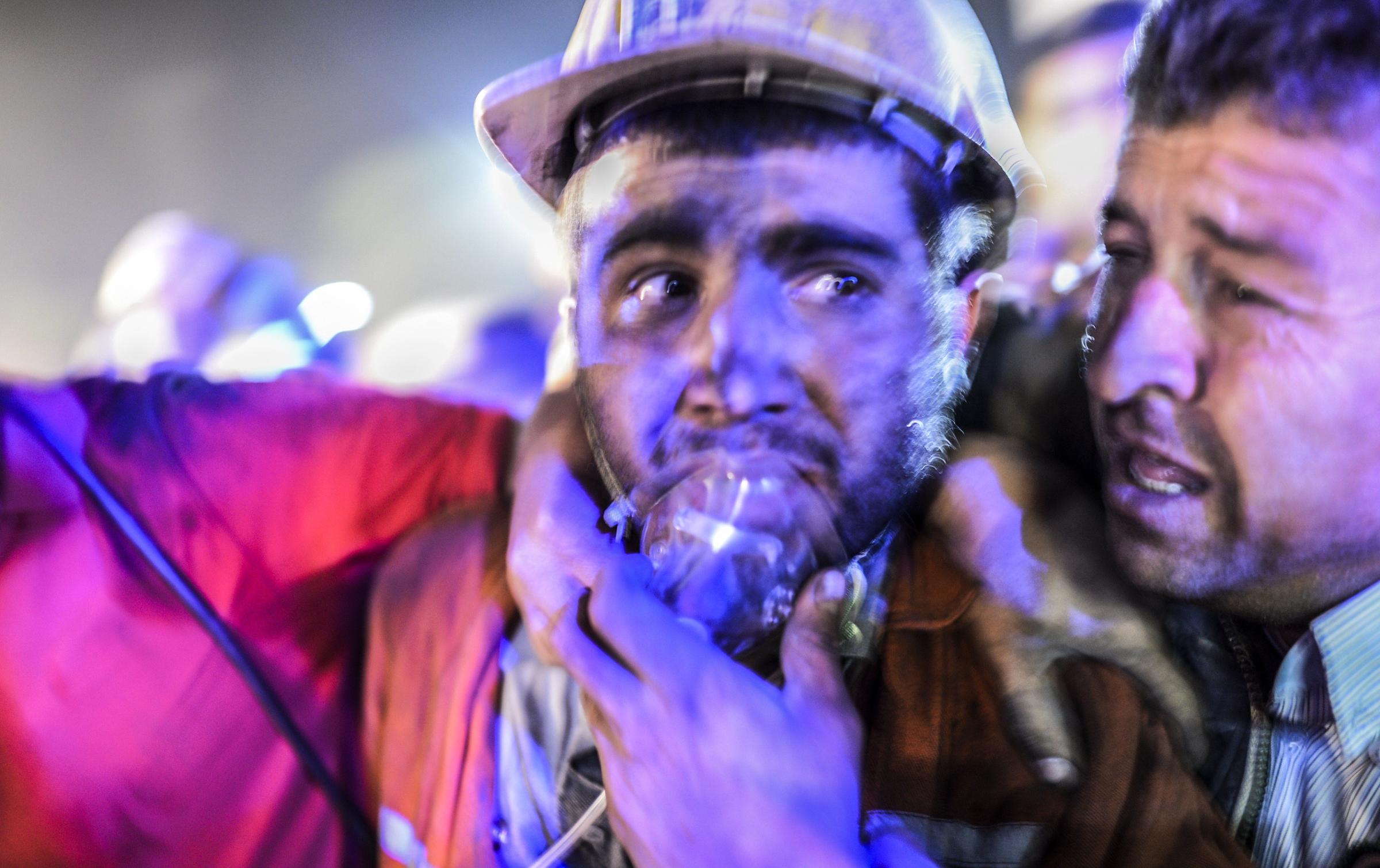 A miner with his father after an explosion on May 13, 2014 in Manisa.