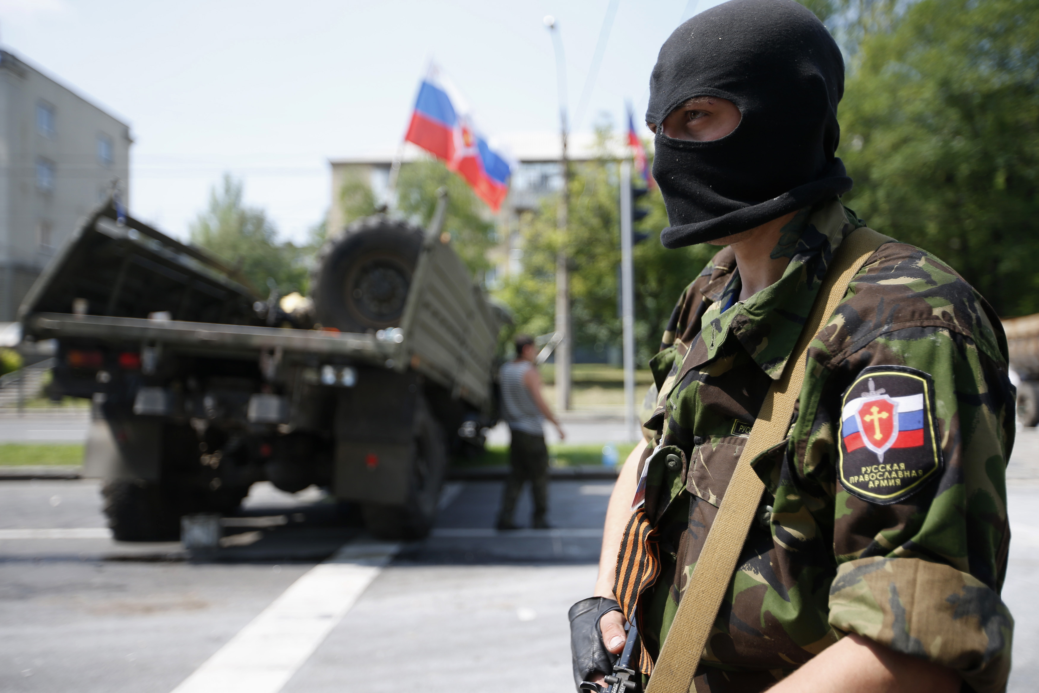 A member of a newly-formed pro-Russian armed group called the Russian Orthodox Army mans a barricade near Donetsk airport on May 29, 2014 in Donetsk, Ukraine. (Maxim Zmeyev—Reuters)