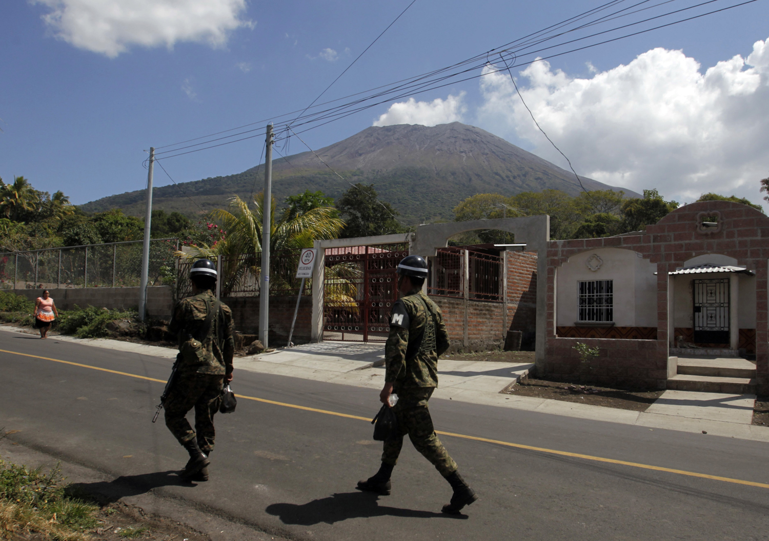 Soldier walk near the area of the Chaparrastique volcano in the municipality of Placitas outside San Salvador