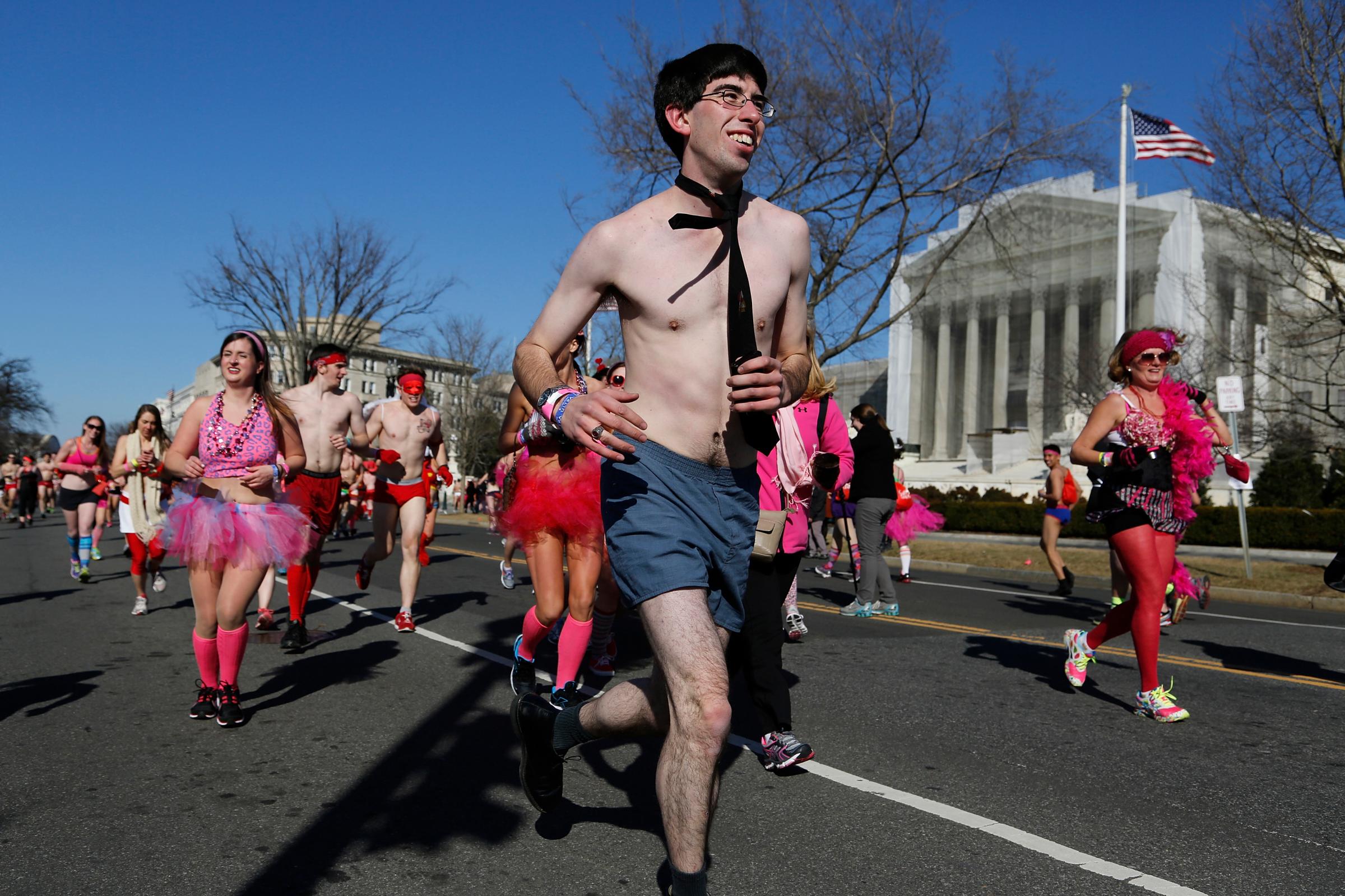 Runners pass the U.S. Supreme Court during the Cupid's Undie Run, billed by organizers as the 'world's largest underwear race', in Washington