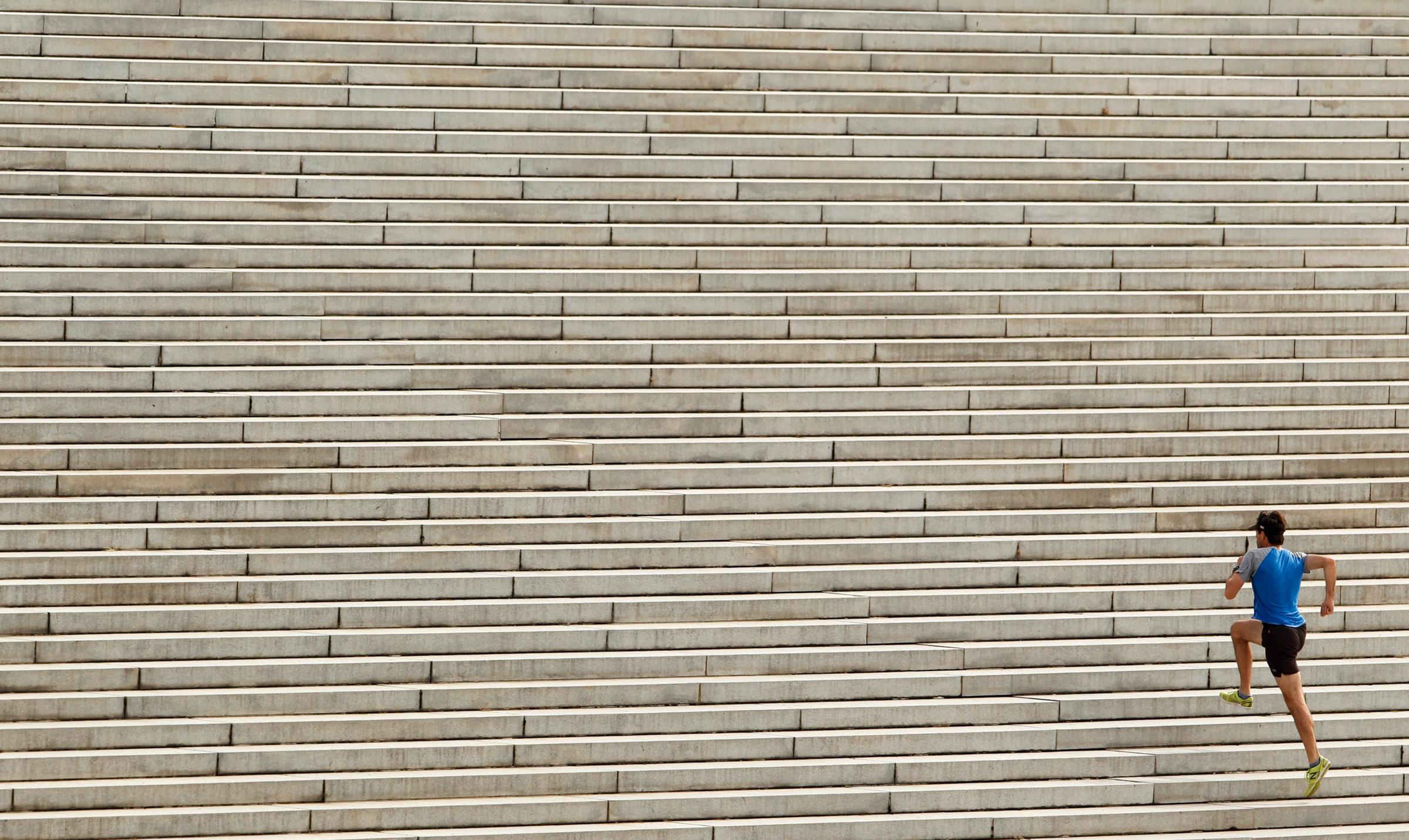 Runner ascends steps at the Lincoln Memorial in Washington