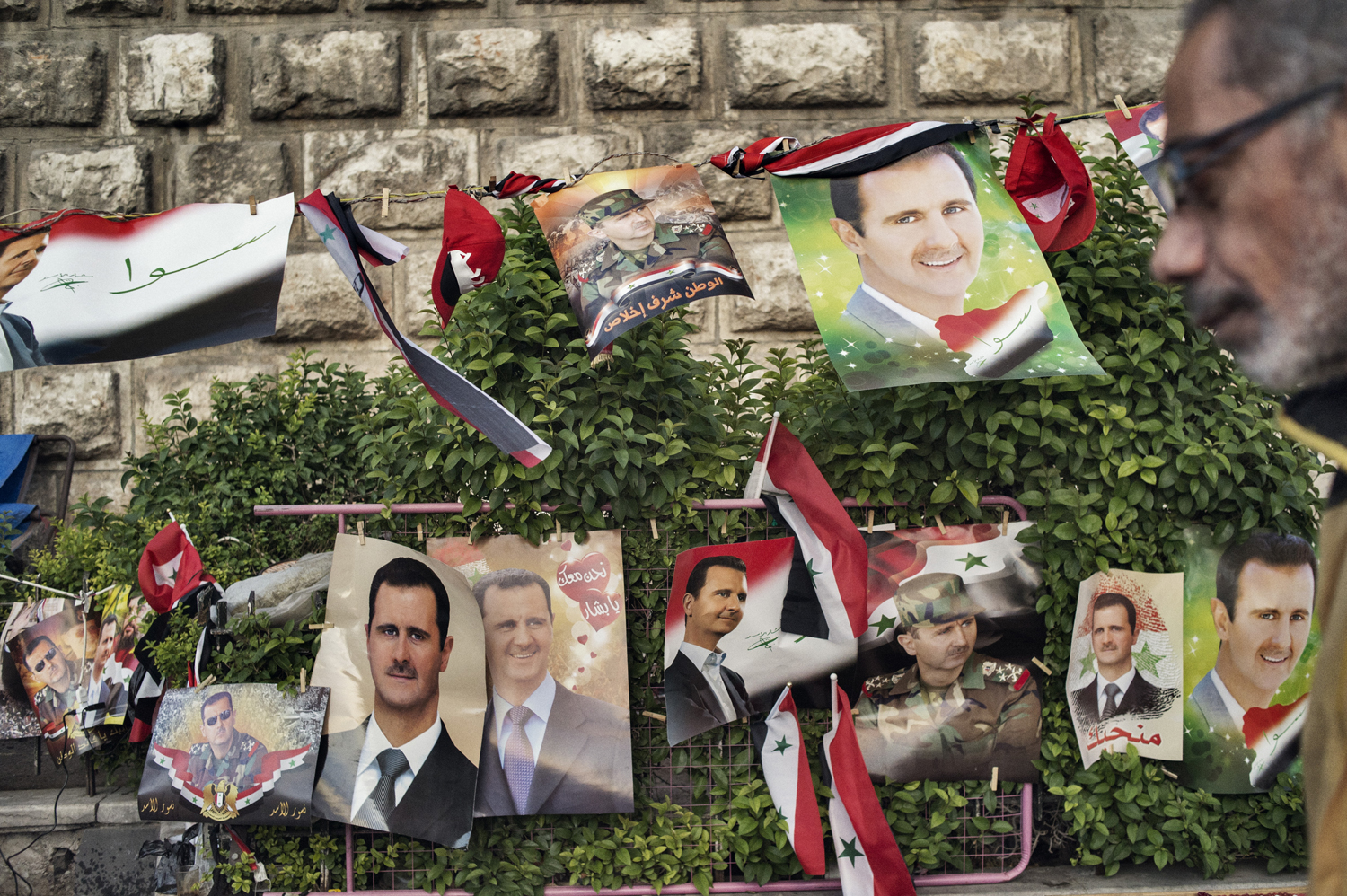 Buildings, checkpoints and billboards in the Syrian capital are festooned with fresh portraits of President Bashar Assad. Damascus, May 16, 2014.