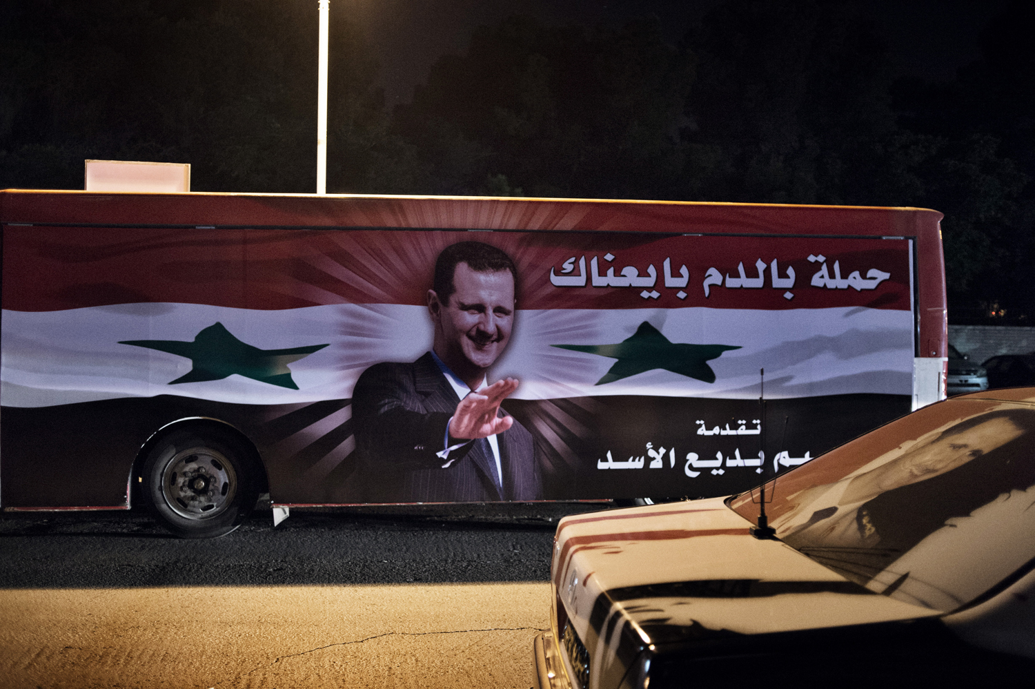 Buildings, checkpoints , cars , buses here in the Syrian capital are festooned with fresh portraits of President Bashar Assad, May 16, 2014.