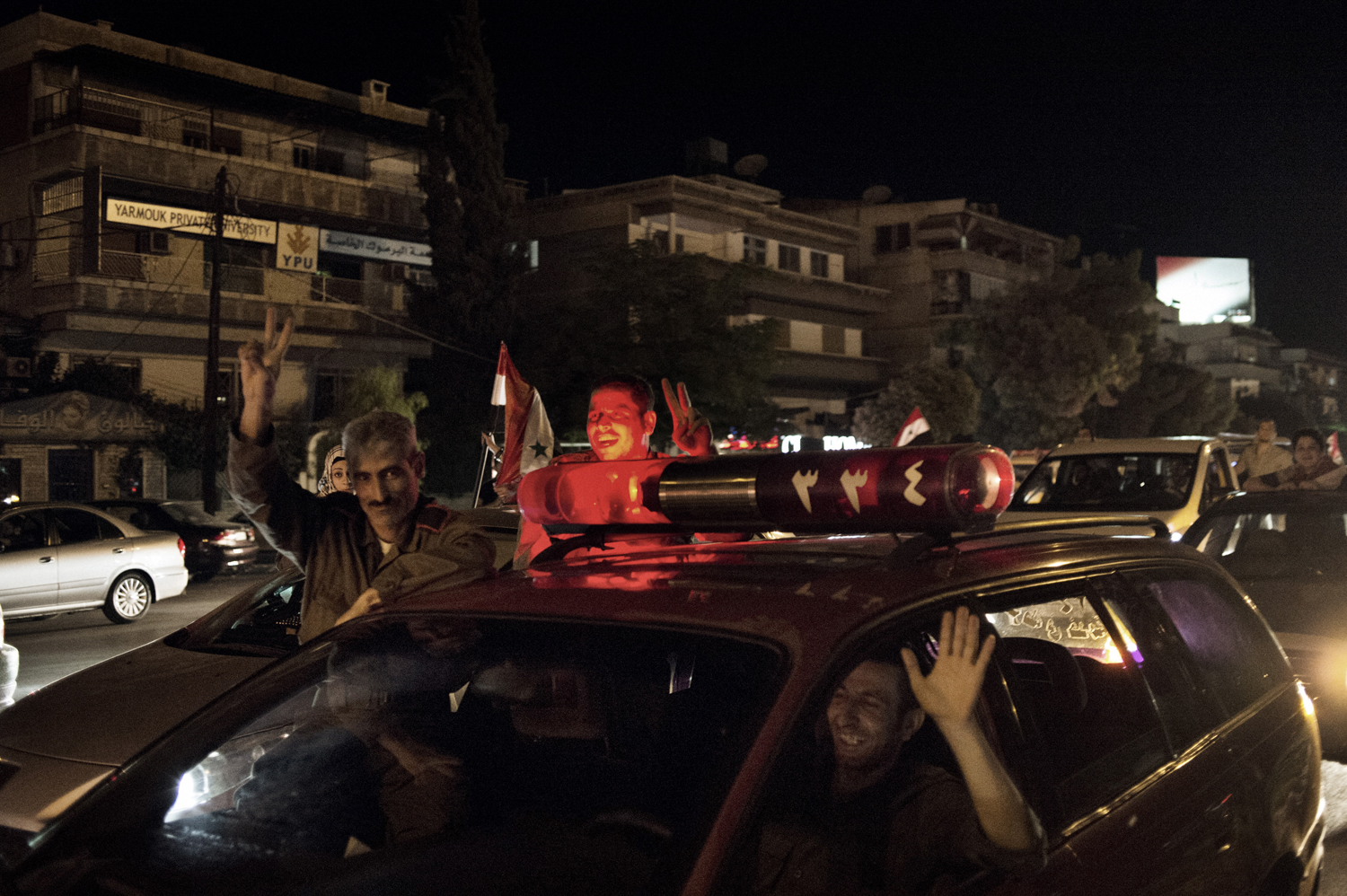 A rally in support of Syria and the president on the Mezze Highway, Damascus, May 18, 2014.