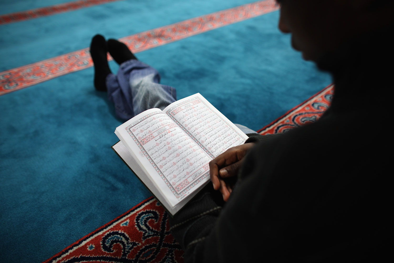 A Muslim man reads the Koran during Ramadan. (Dan Kitwood—Getty Images)