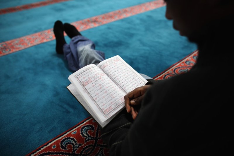 A Muslim man reads the Koran during Ramadan.