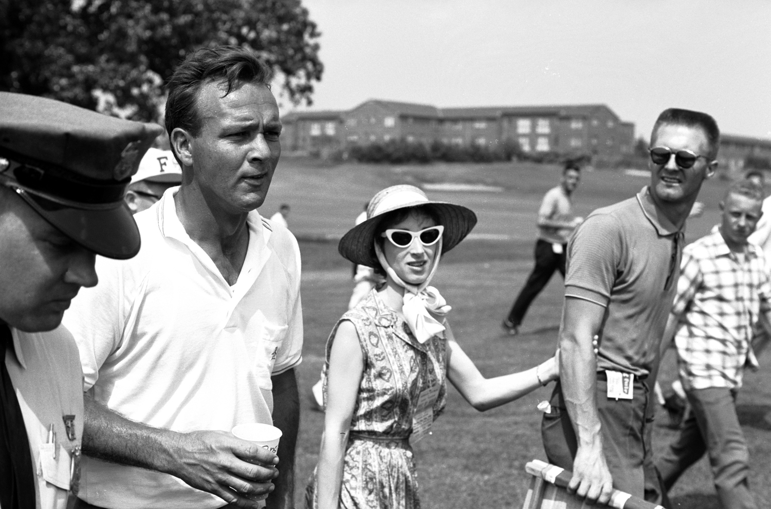 Arnold Palmer walking at the Masters in 1962.