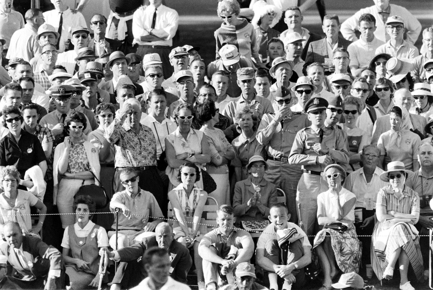 Crowd watching Arnold Palmer at the 1962 Masters Tournament.