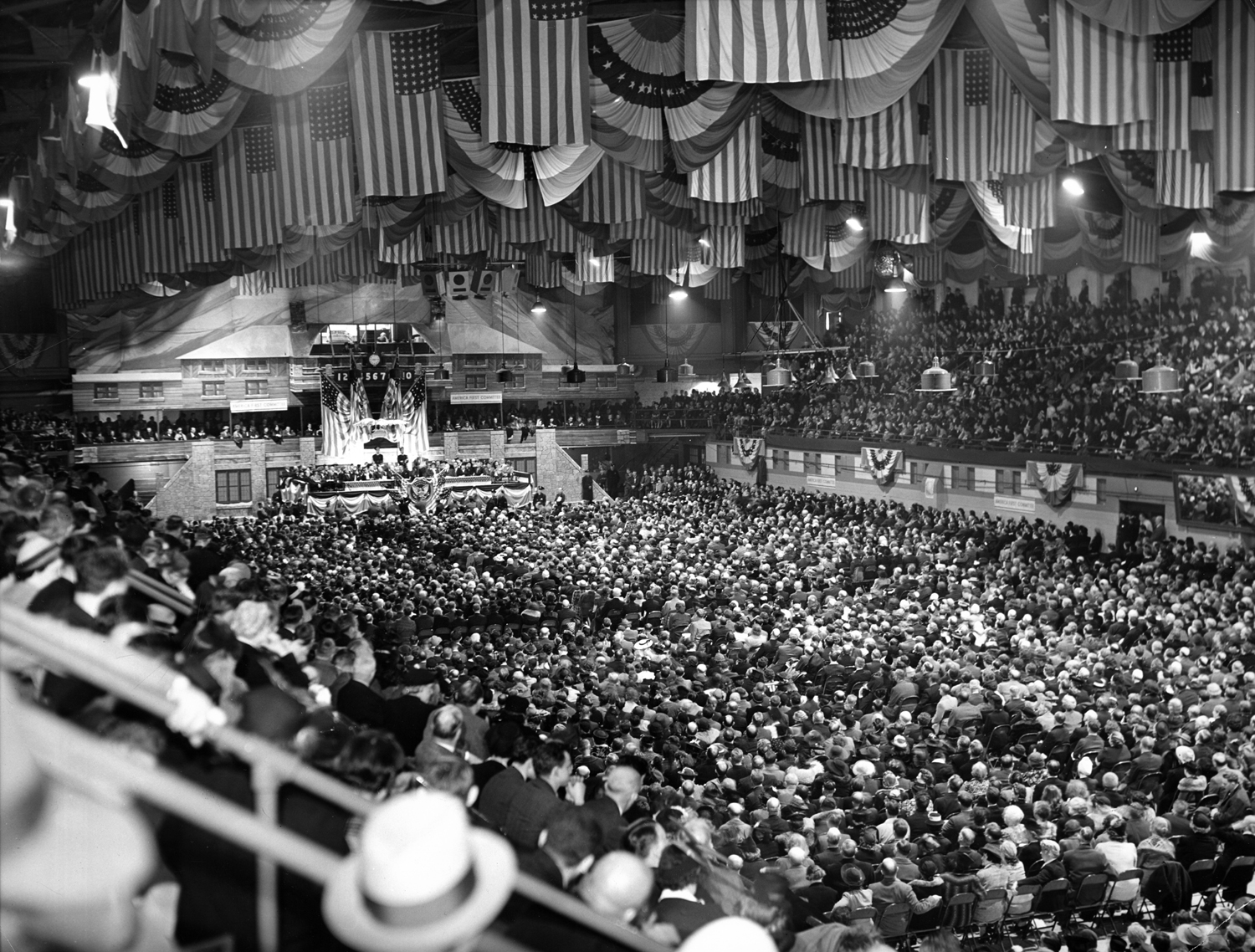 Crowd of 10,000 at an "America First Committee" rally listening to speeches promulgating isolationism and urging the cutting off of aid to Britain, Chicago Arena, 1941