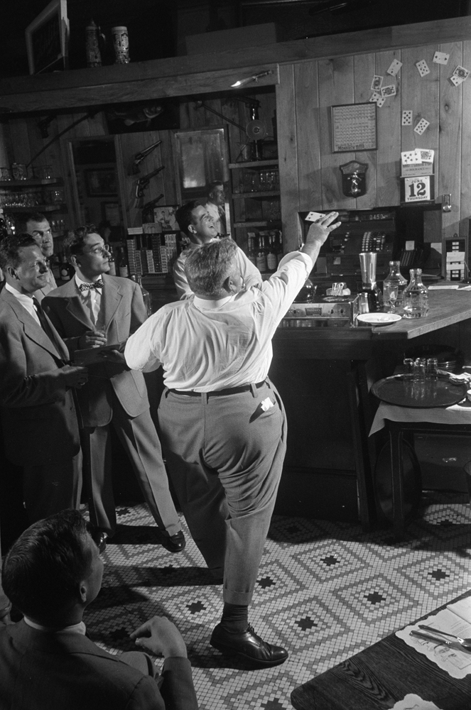 Legendary Chicago club owner Matt Schulien entertains patrons, 1952.