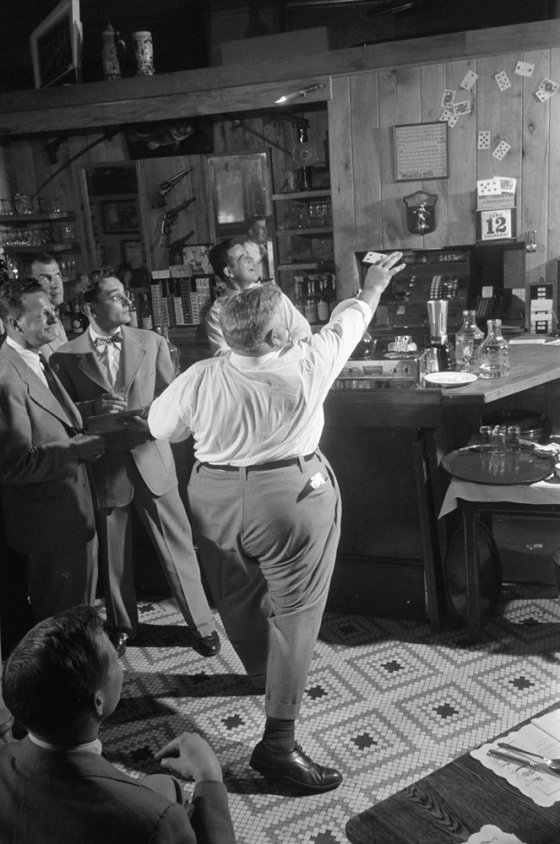 Legendary Chicago club owner Matt Schulien entertains patrons, 1952.
