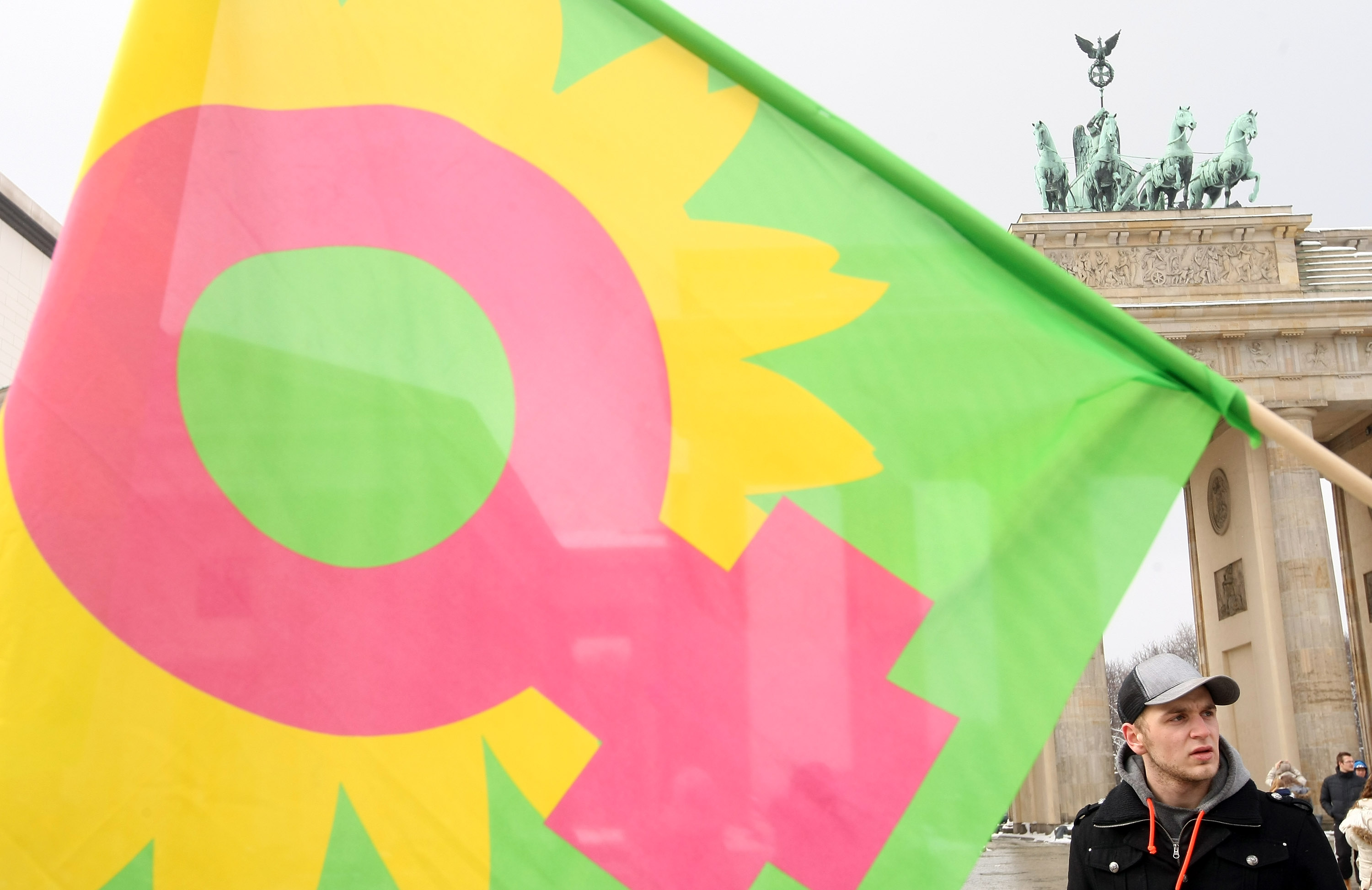 A flag with the female gender sign waves at an Equal Pay Day rally in front of the Brandenburg Gate on March 21, 2013 in Berlin, Germany. (Adam Berry&mdash;Getty Images)
