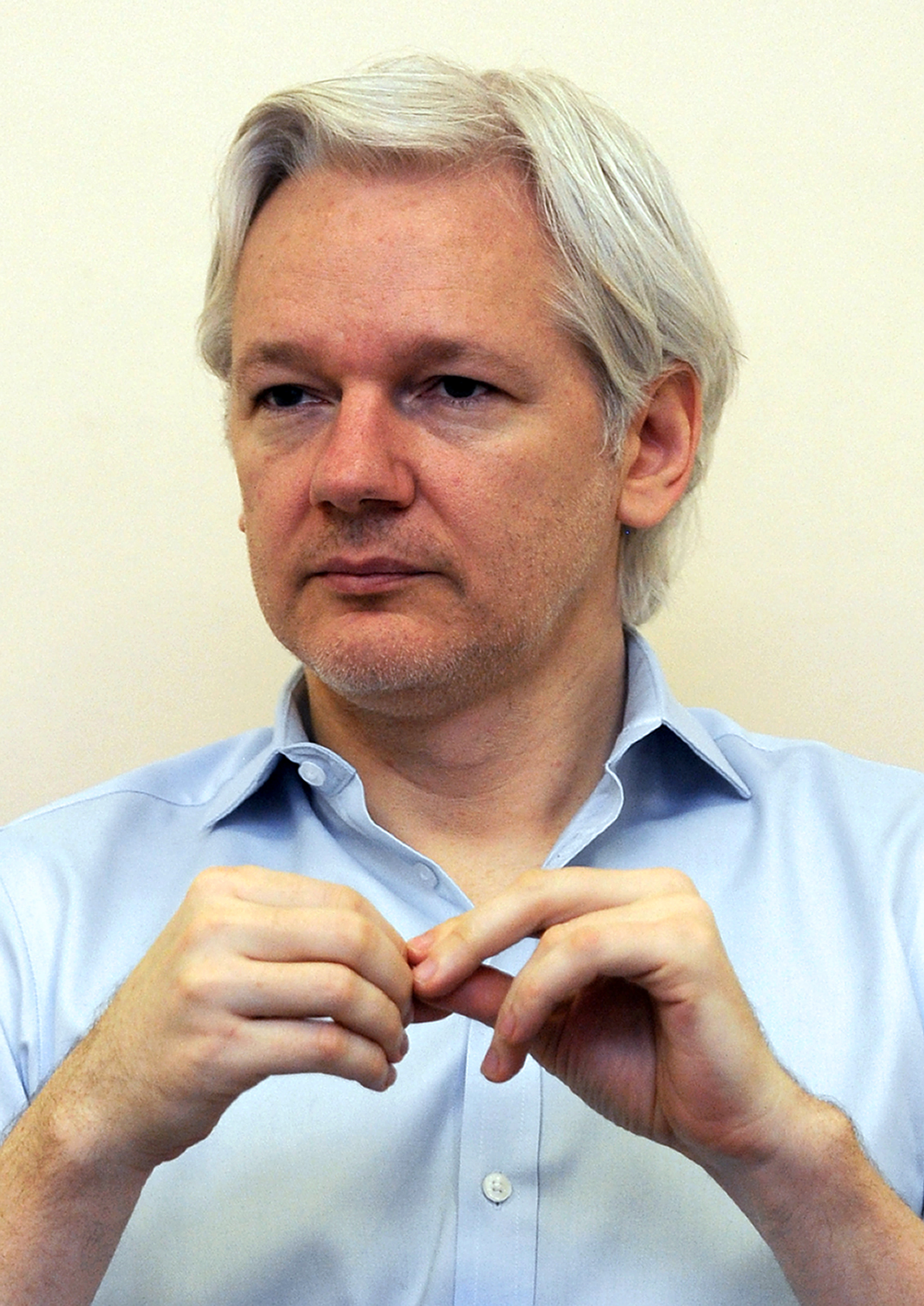 WikiLeaks founder Julian Assange speaks to the media inside the Ecuadorean embassy in London on June 14, 2013. (Anthony Devlin—AFP/Getty Images)