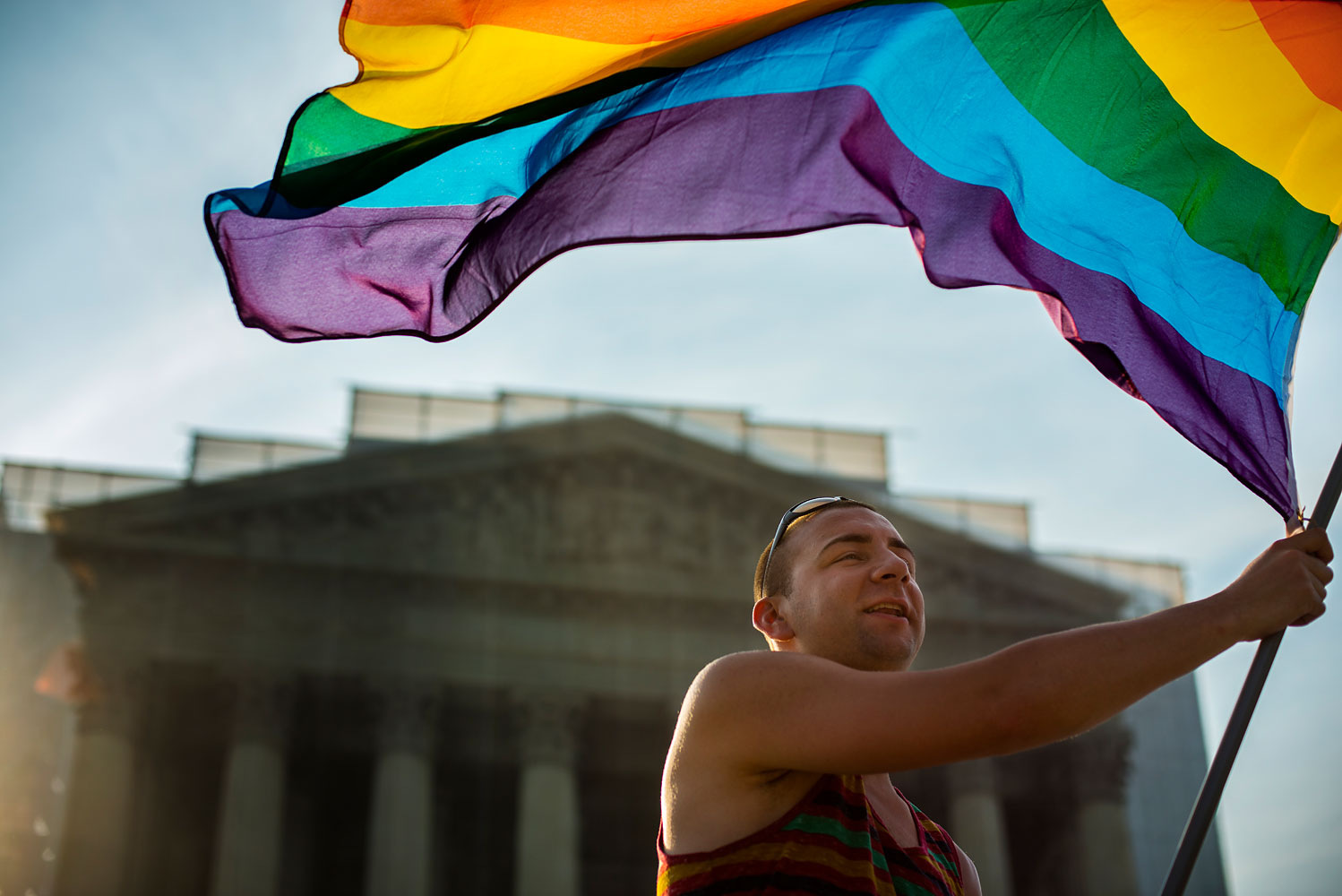 Same-sex-marriage supporters wave a rainbow flag in front of the U.S. Supreme Court in Washington, D.C., on June 26, 2013 (Marvin Joseph—The Washington Post/Getty Images)