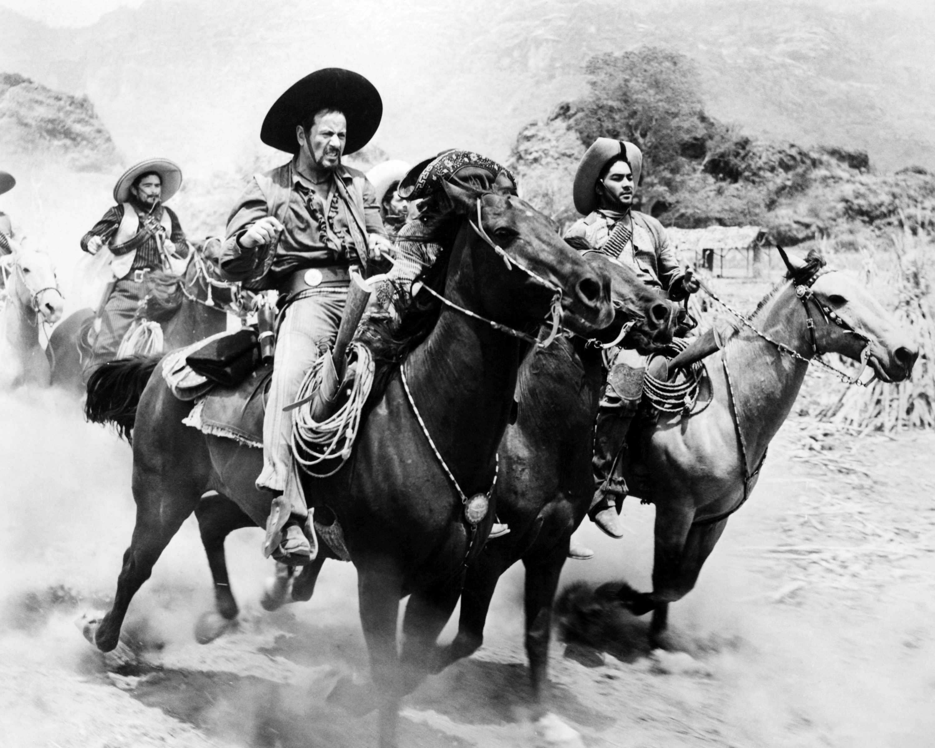 American actor Eli Wallach (foreground, left), as the bandit leader, Calvera, in 'The Magnificent Seven', directed by John Sturges, 1960. (Photo by Silver Screen Collection/Getty Images) (Silver Screen Collection—Getty Images)