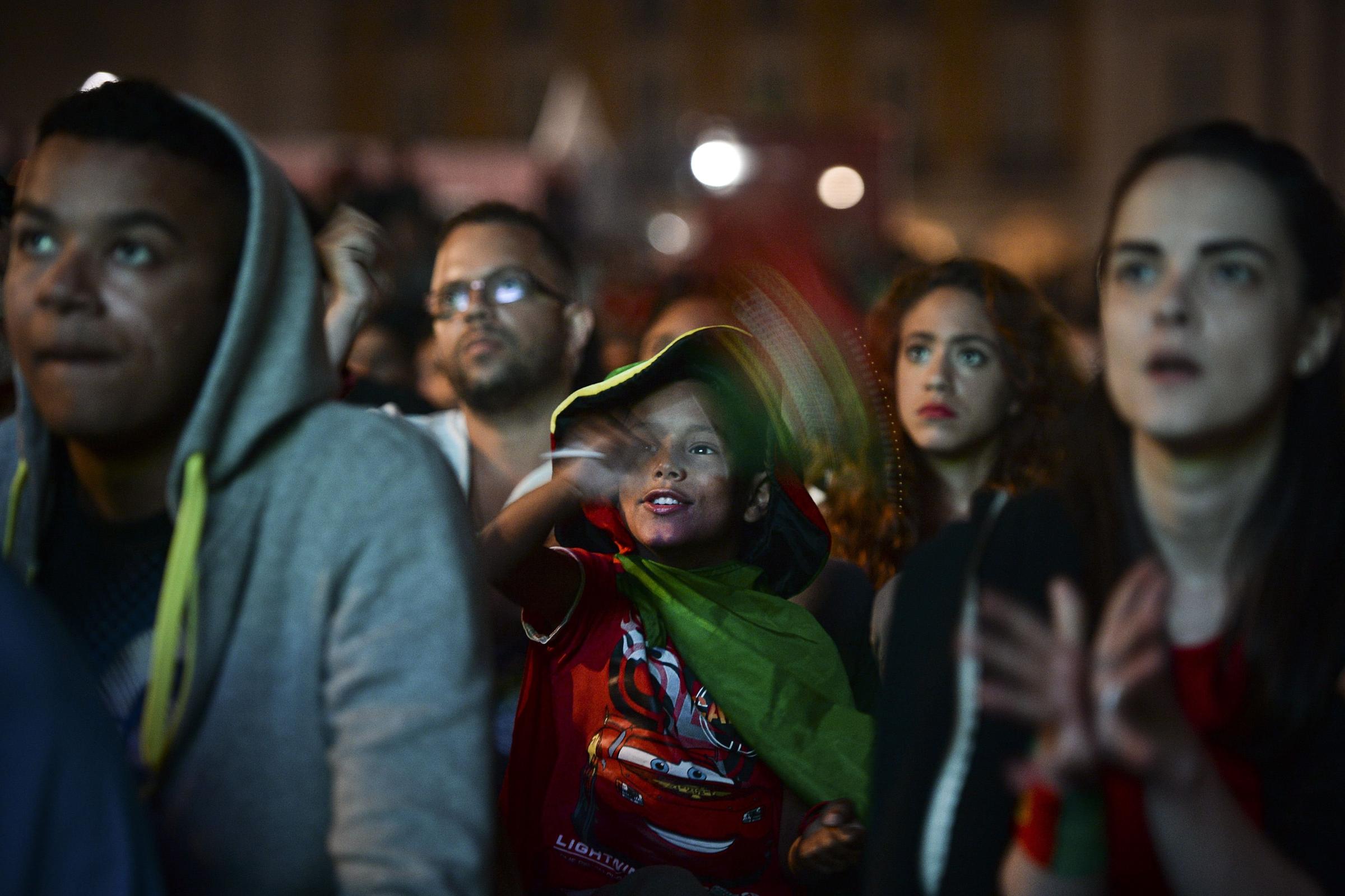 Supporters of the Portuguese national team gather at Terreiro do Paco Square in Lisbon on June 22, 2014 during a public viewing of the FIFA World Cup 2014 group G match between Portugal and the US played in Manaus, Brazil.
