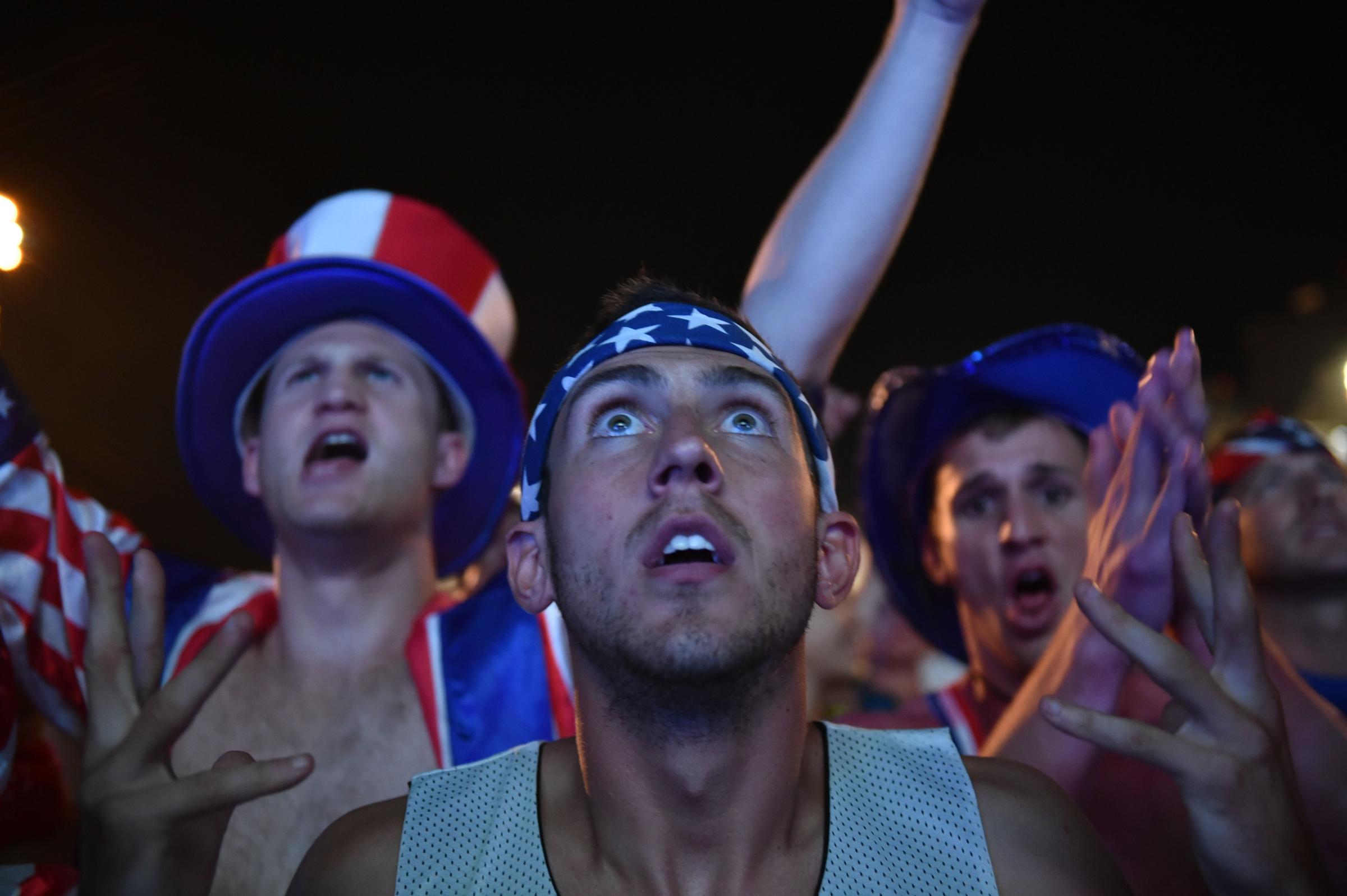 US fans watch a 2014 World Cup Group G football match USA vs Portugal on a giant screen in Rio de Janeiro, on June 22, 2014.