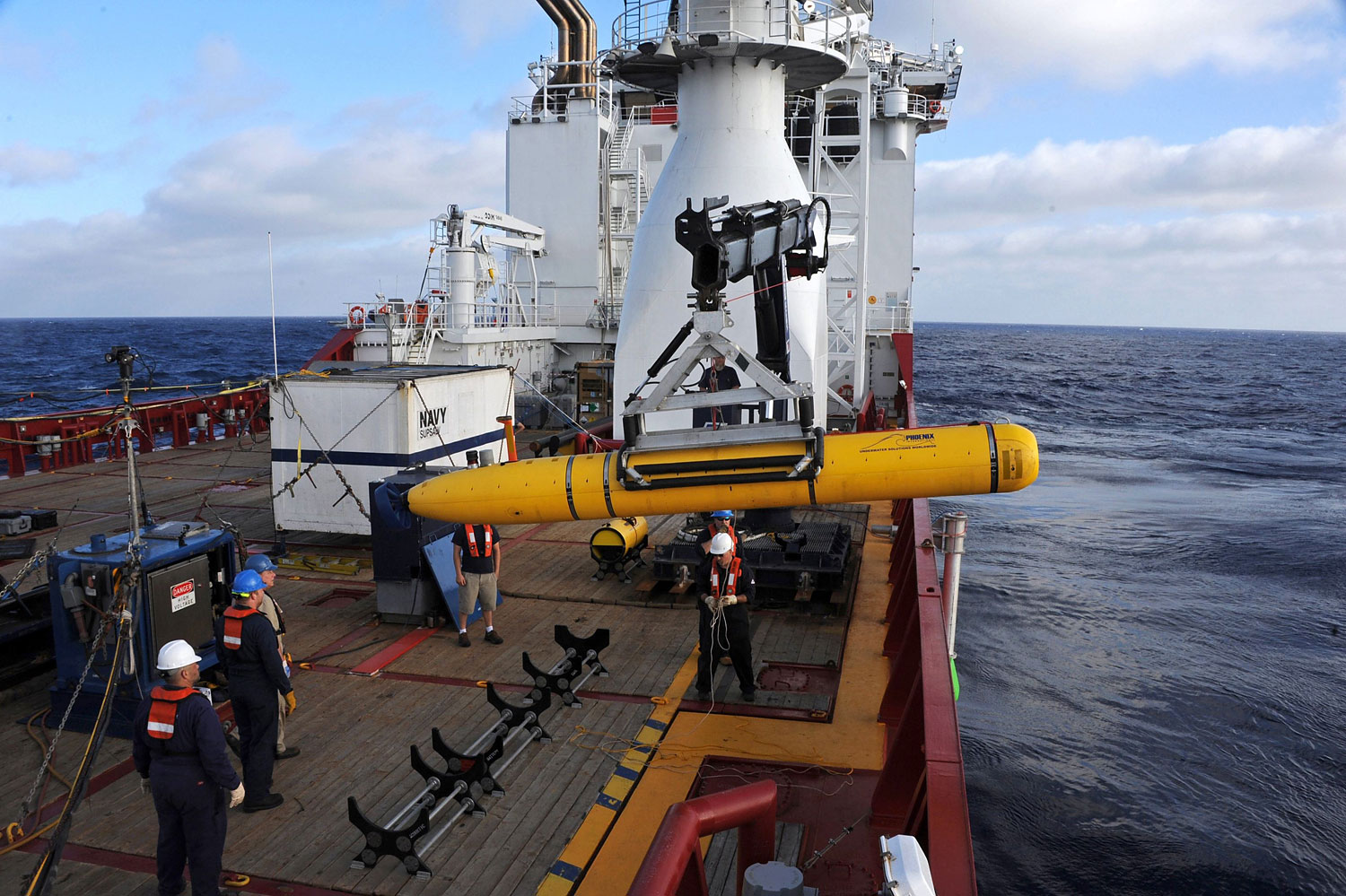 Crew aboard the Australian Defence Vessel Ocean Shield move the U.S. Navyís Bluefin-21 into position for deployment, in the southern Indian Ocean to look for the missing Malaysian Airlines flight MH370