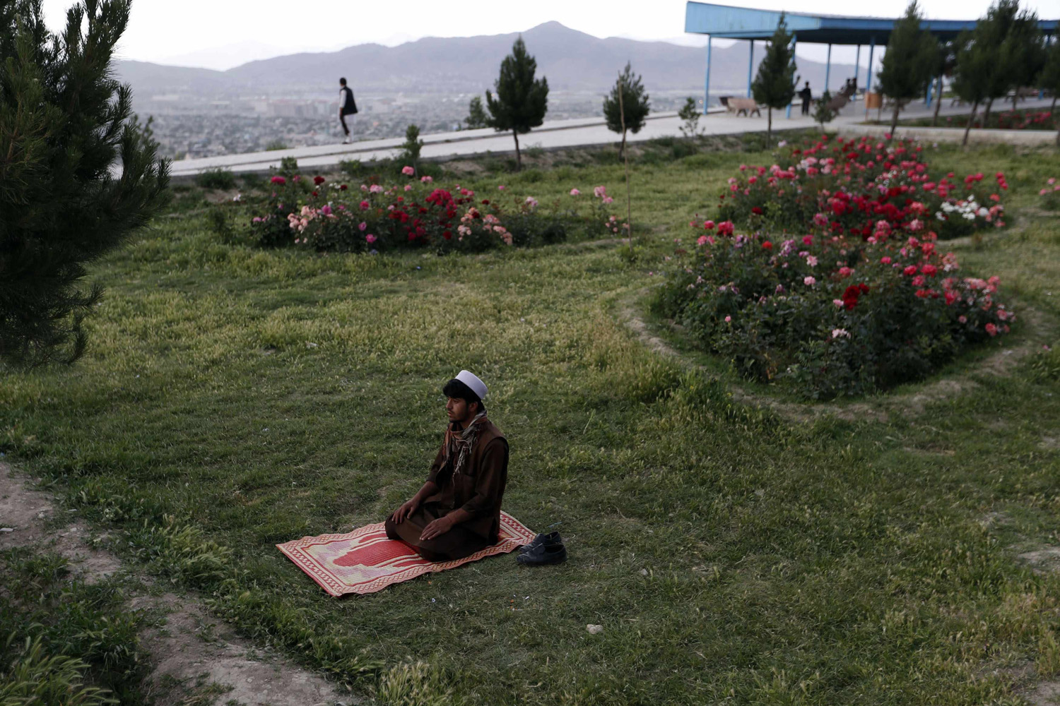 An Afghan man prays in Kabul