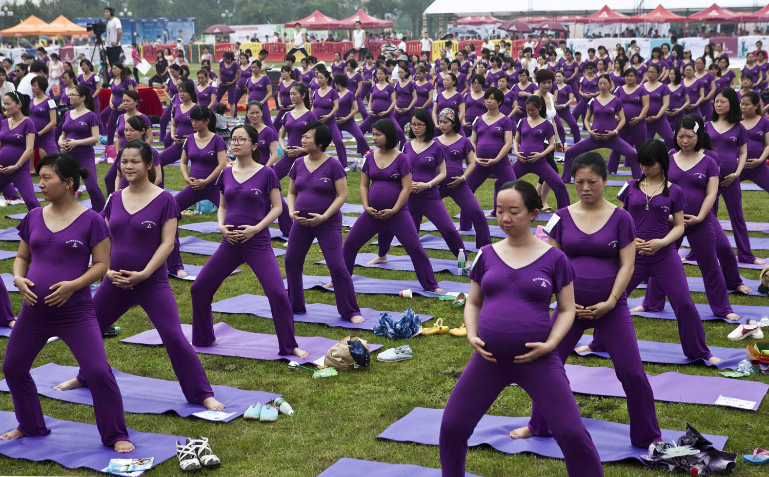 Pregnant women practice yoga as they attempt to break the Guinness World Record for the largest prenatal yoga class, in Changsha