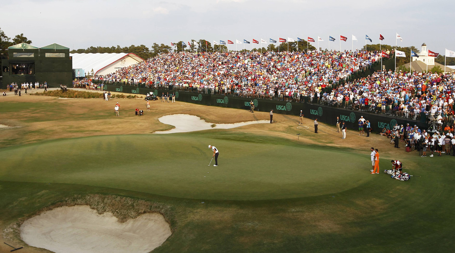 Martin Kaymer of Germany sinks his putt on the 18th green to win the U.S. Open Championship golf tournament in Pinehurst