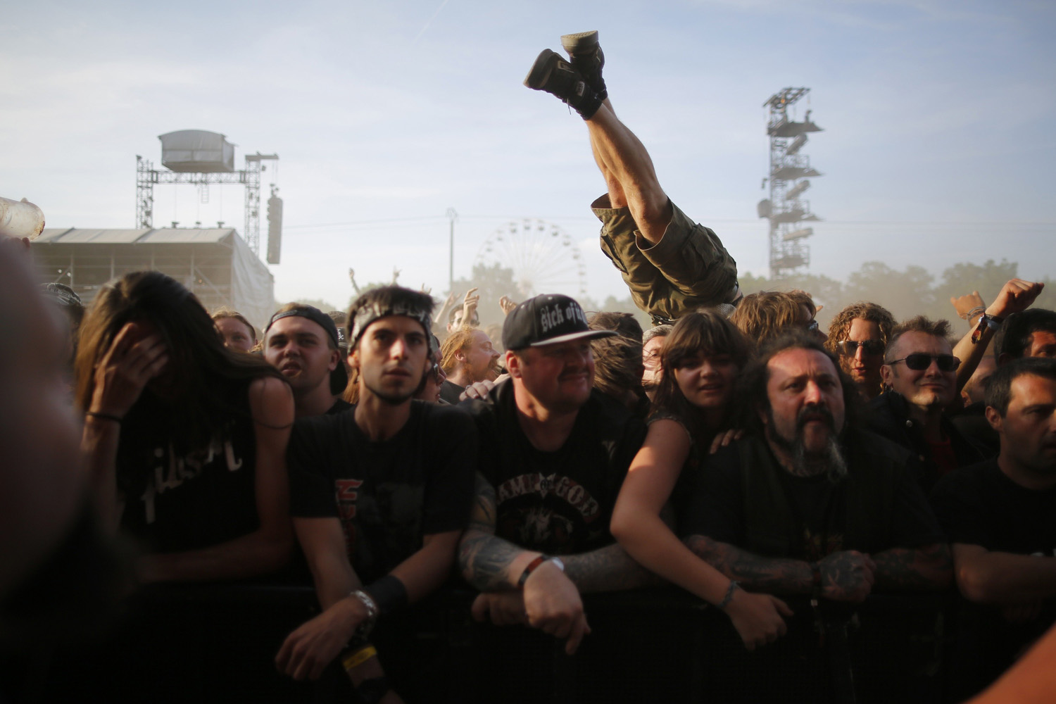 Festival-goers react during the Hellfest music Festival in Clisson, western France on June 20, 2014.