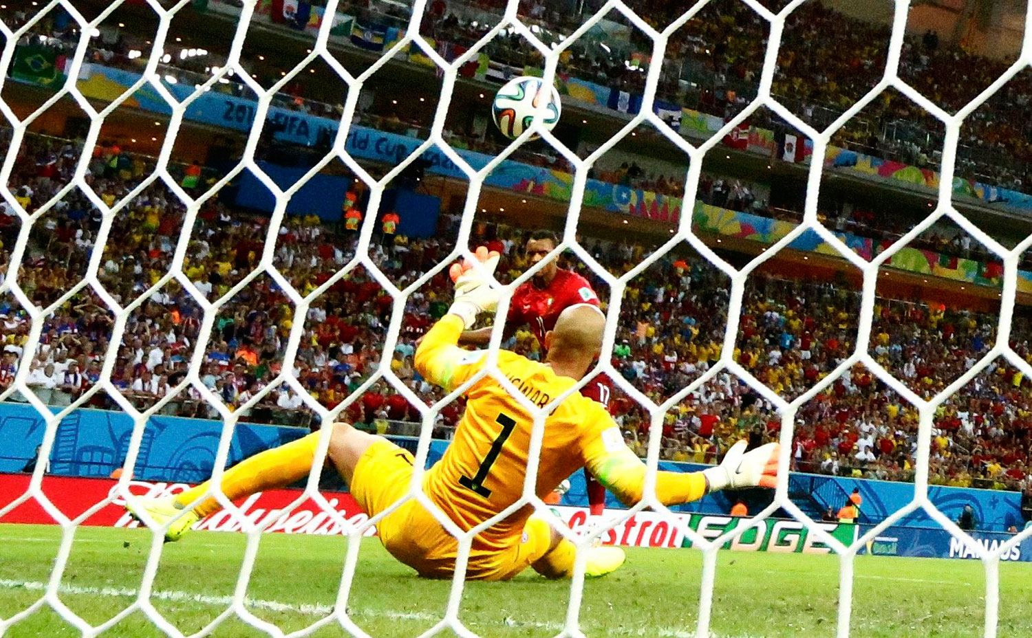 Portugal's Nani scores past goalkeeper Tim Howard of the U.S. during their 2014 World Cup G soccer match at the Amazonia arena