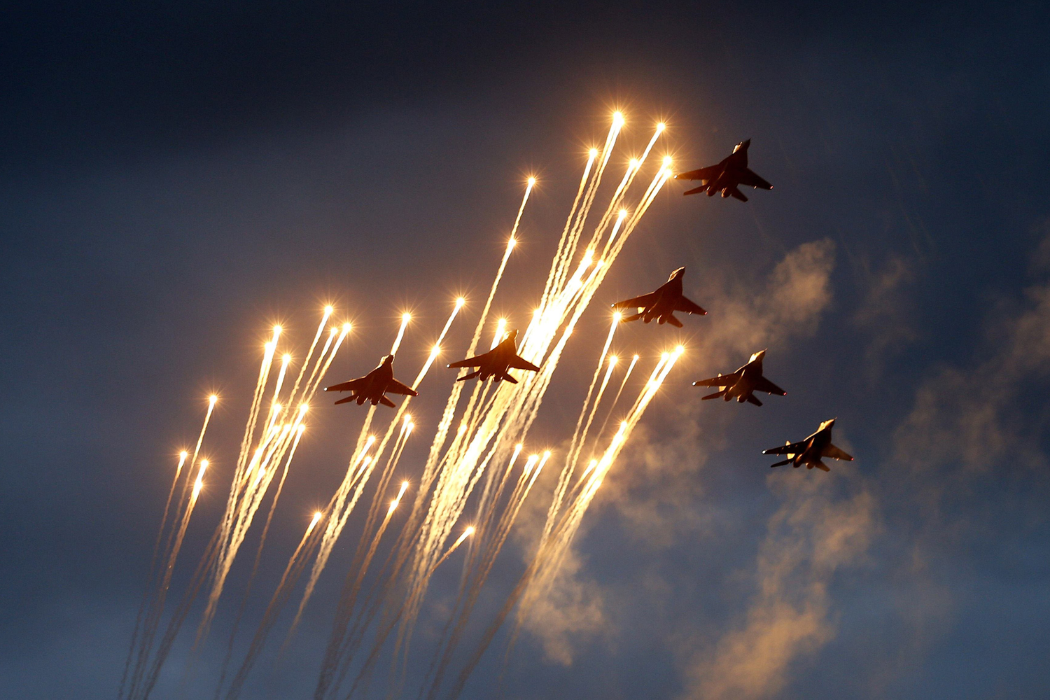 Belarussian MiG-29 jet fighters take part in a rehearsal for a military parade in Minsk