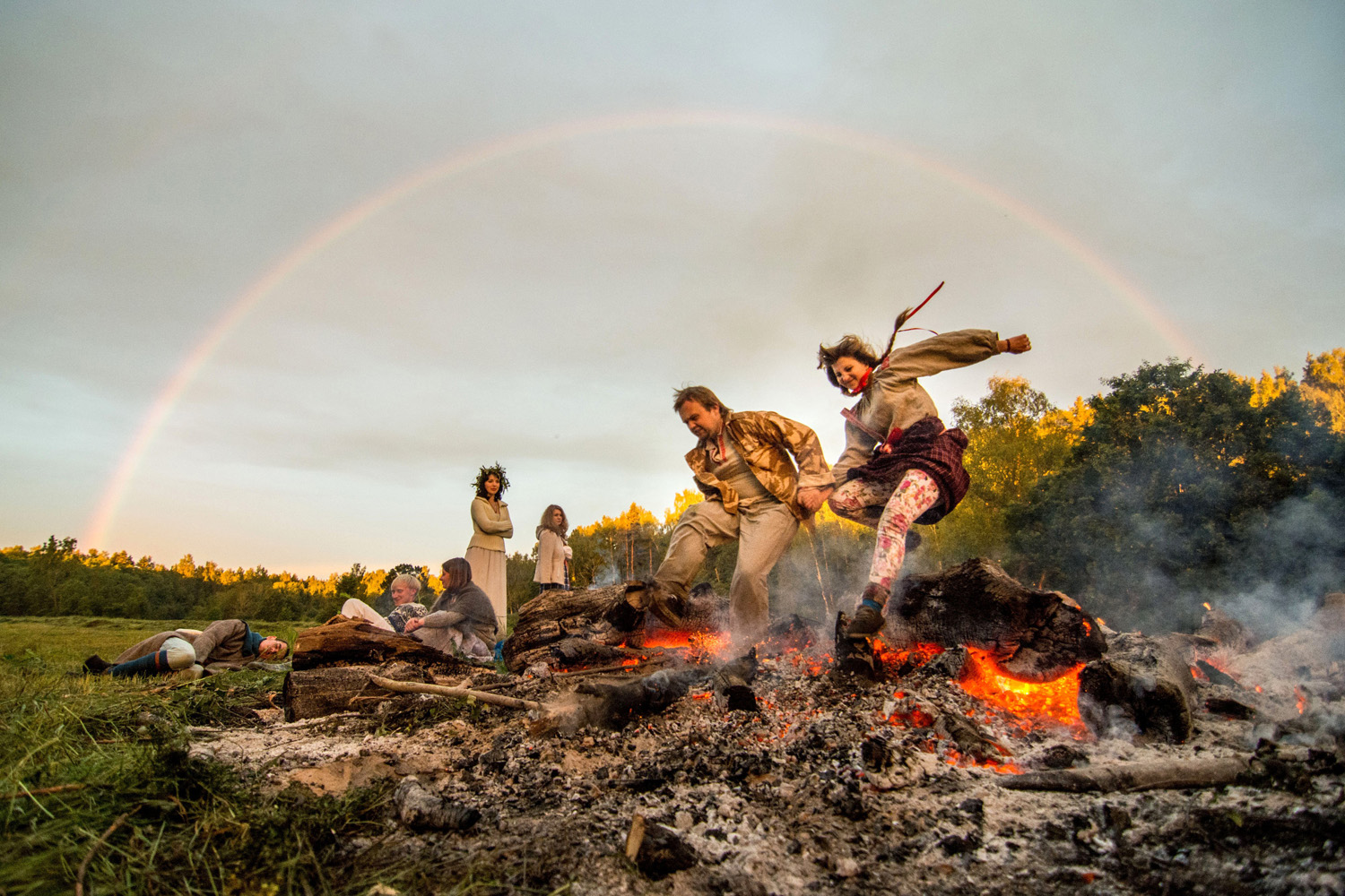 Men and women celebrate Ivan Kupala night, an ancient heathen holiday, in the countryside near a village in the Kulneva some 280 km north of Minsk, Belarus late on June 22, 2014.