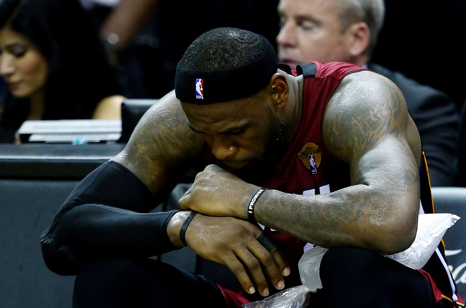 LeBron James #6 of the Miami Heat sits on the bench after leaving the game in the fourth quarter with cramps against the San Antonio Spurs during Game One of the 2014 NBA Finals at the AT&amp;T Center on June 5, 2014 in San Antonio. (Andy Lyons—Getty Images)
