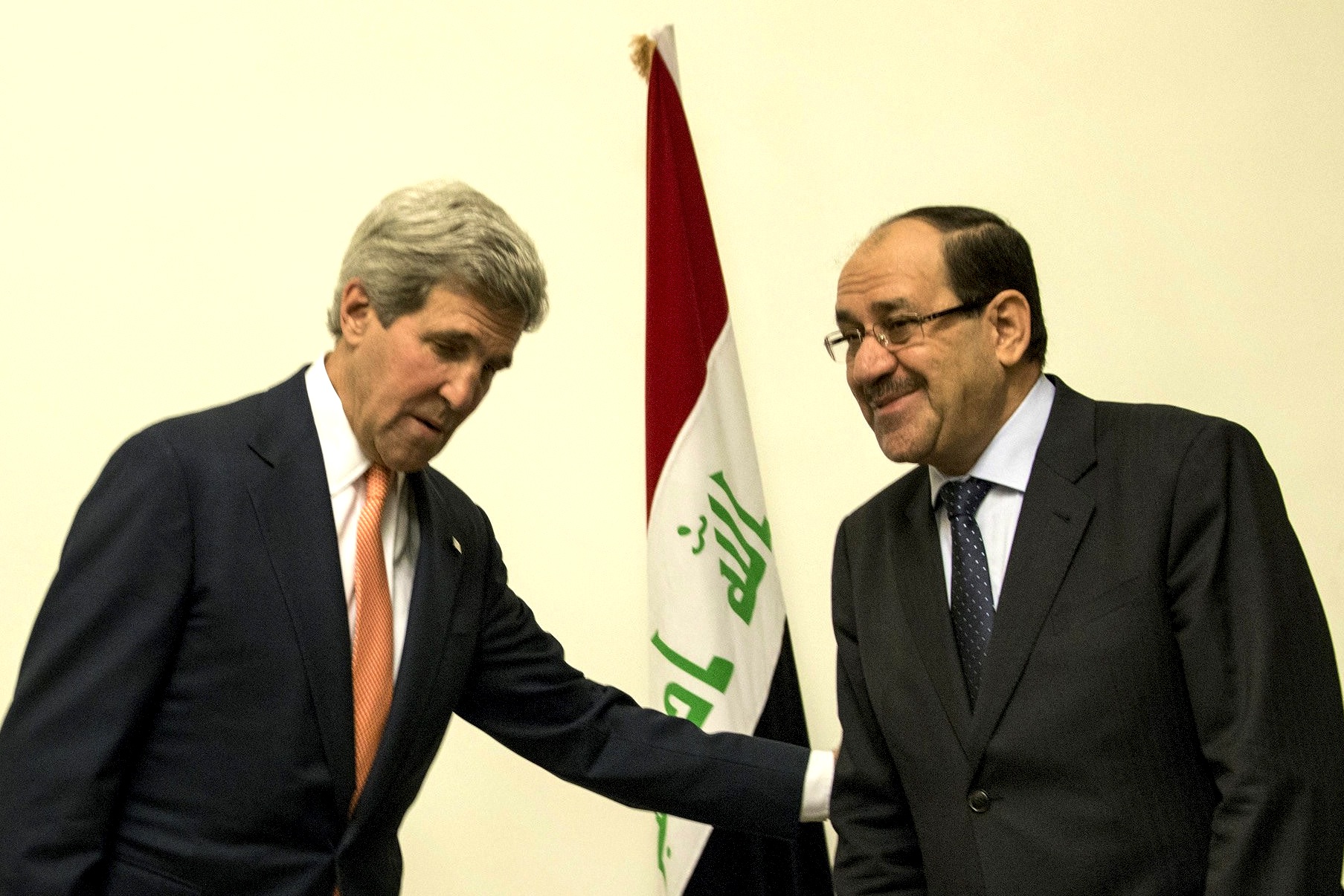 Secretary of State John Kerry and Iraqi Prime Minister Nouri al-Maliki met Monday in Baghdad. (BRENDAN SMIALOWSKI / AFP / Getty Images)