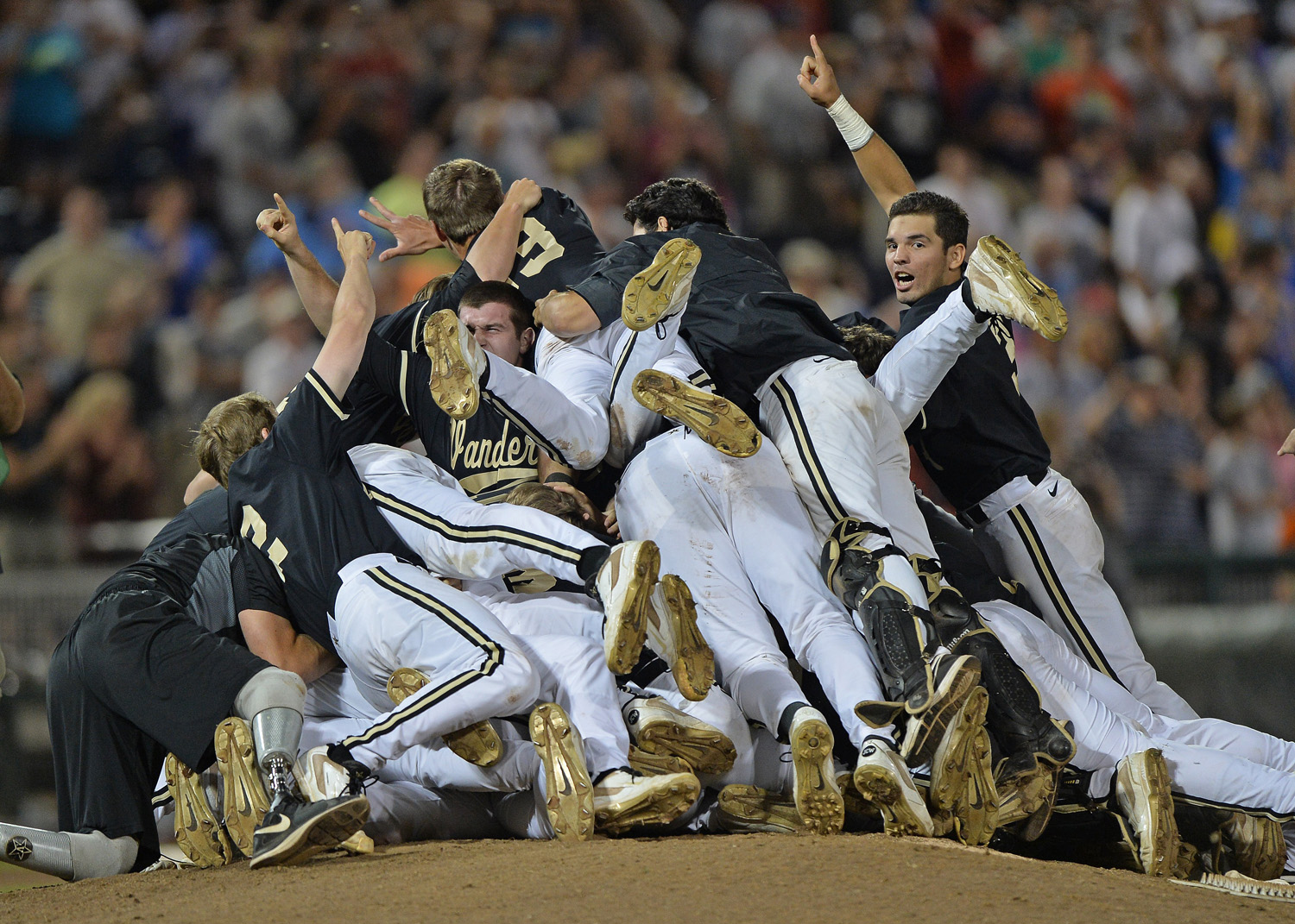 The Vanderbilt Commodores players celebrate after beating the Virginia Cavaliers 3-2 to win the College World Series Championship  at TD Ameritrade Park in Omaha on June 25, 2014.