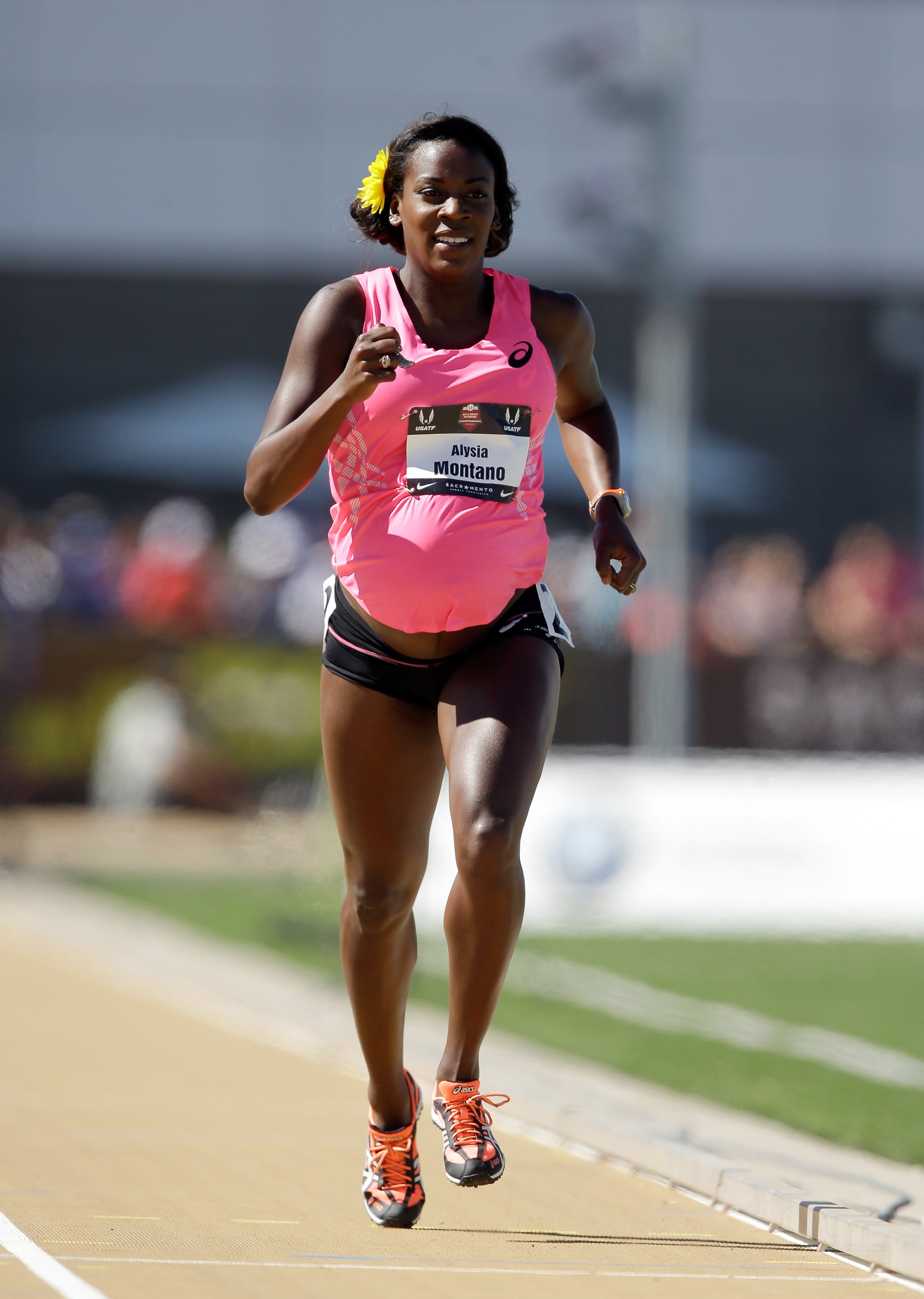 A pregnant Alysia Montano runs in the opening round of the women's 800 meter run during day 2 of the USATF Outdoor Championships at Hornet Stadium in Sacramento, California on on June 26, 2014.
