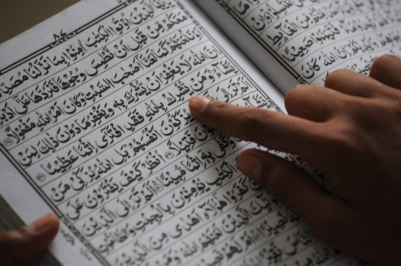 A Indian Muslim reads the Koran at a madrassa during the Islamic holy fasting month of Ramadan in Mumbai on June 30, 2014.