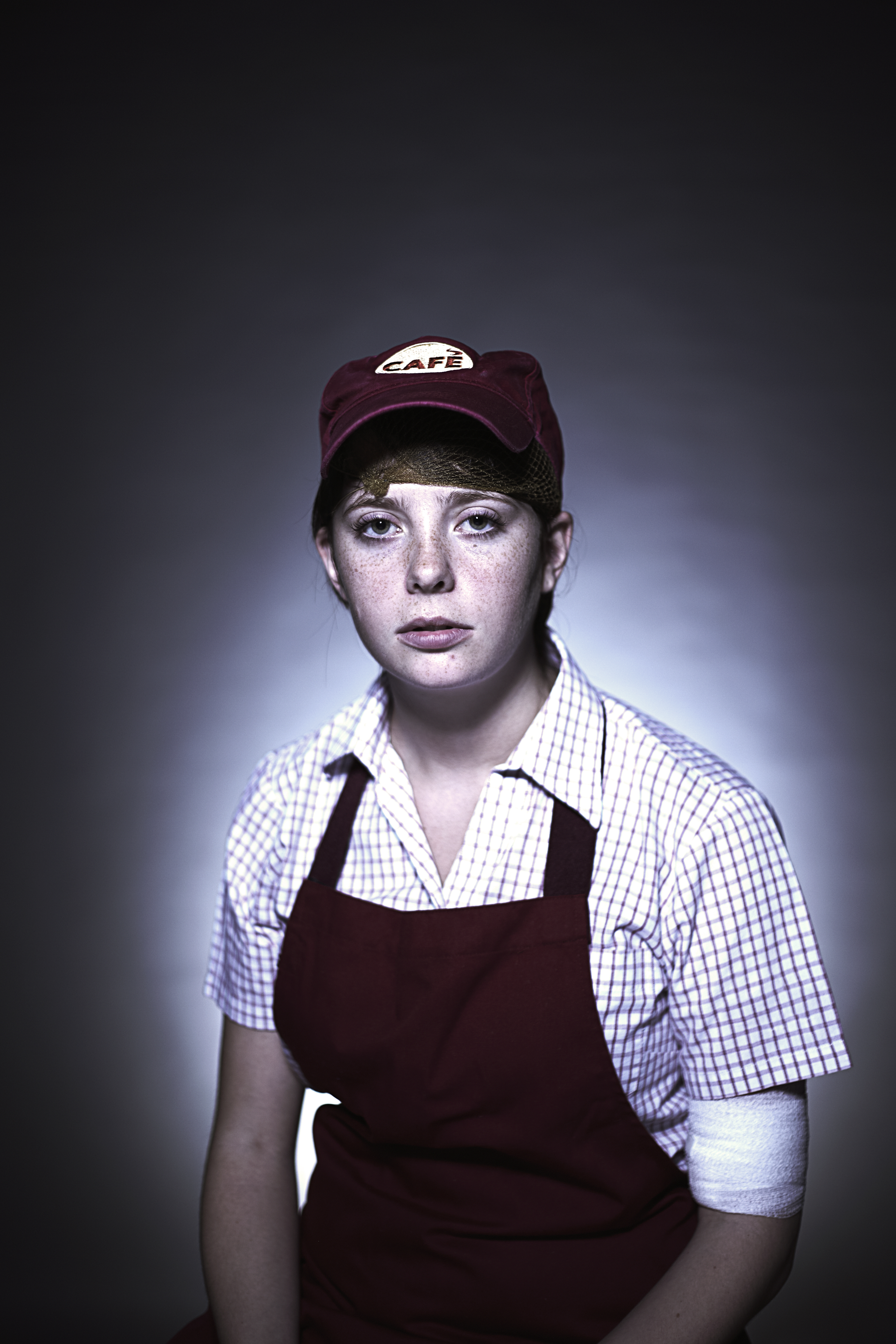 Portrait of a exhausted female cafe worker (Jamie Garbutt&mdash;Getty Images)