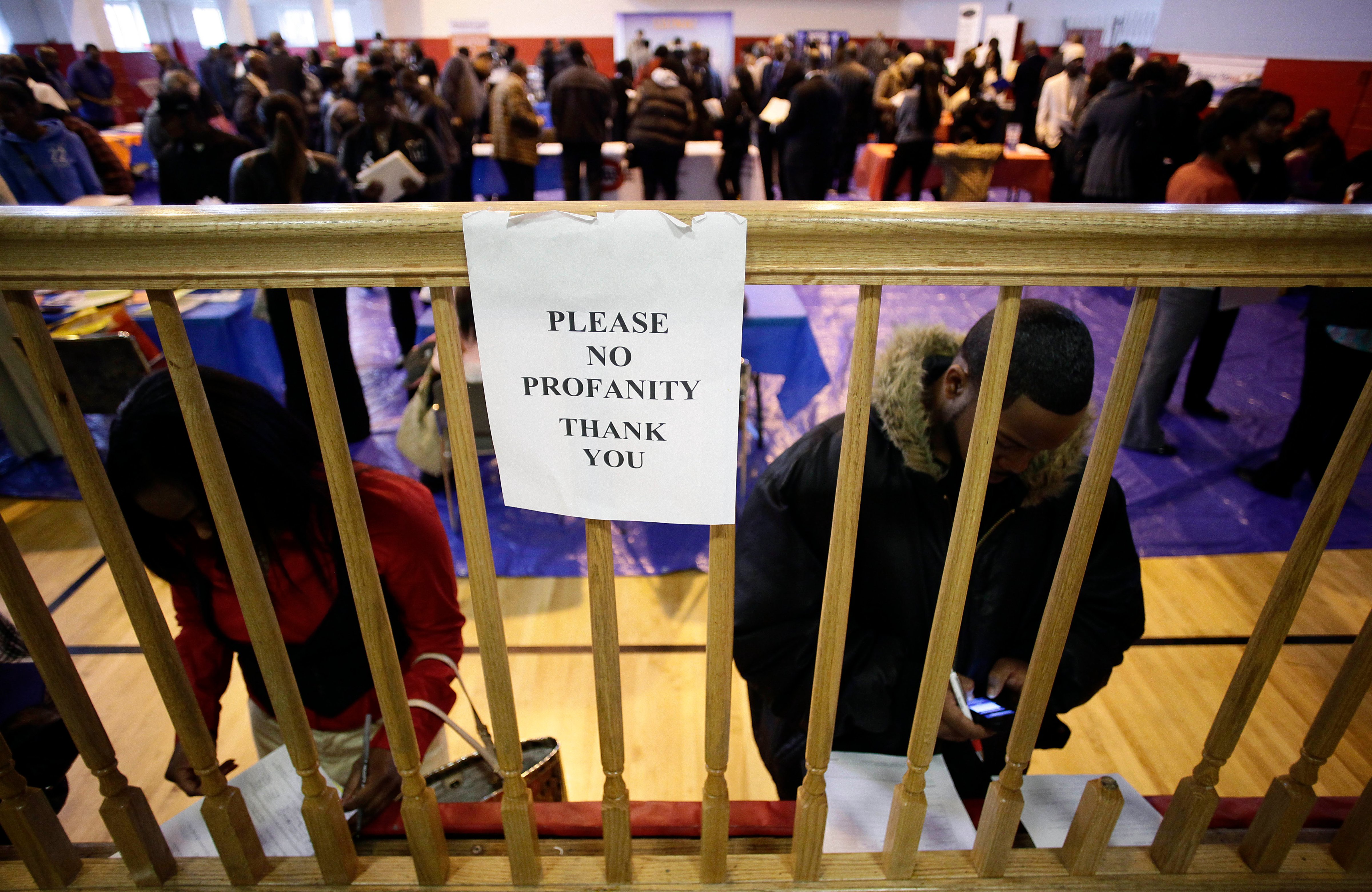 People seeking employment attend a job fair at the Matrix Center, April 23, 2014 in Detroit, Michigan. (Joshua Lott—Getty Images)