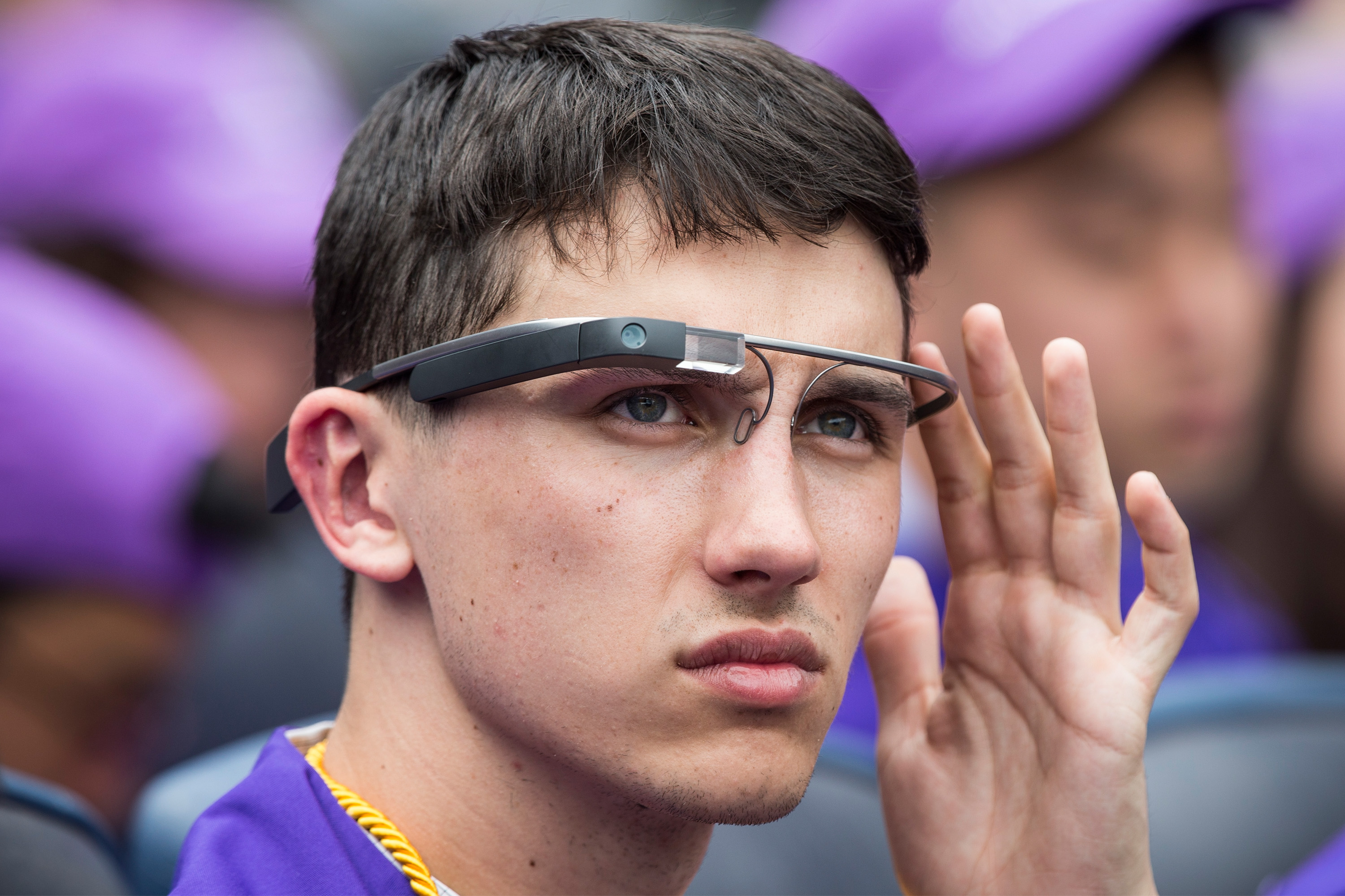 A student wears Google Glass at the 2014 New York University graduation ceremony at Yankee Stadium (Andrew Burton—Getty Images)