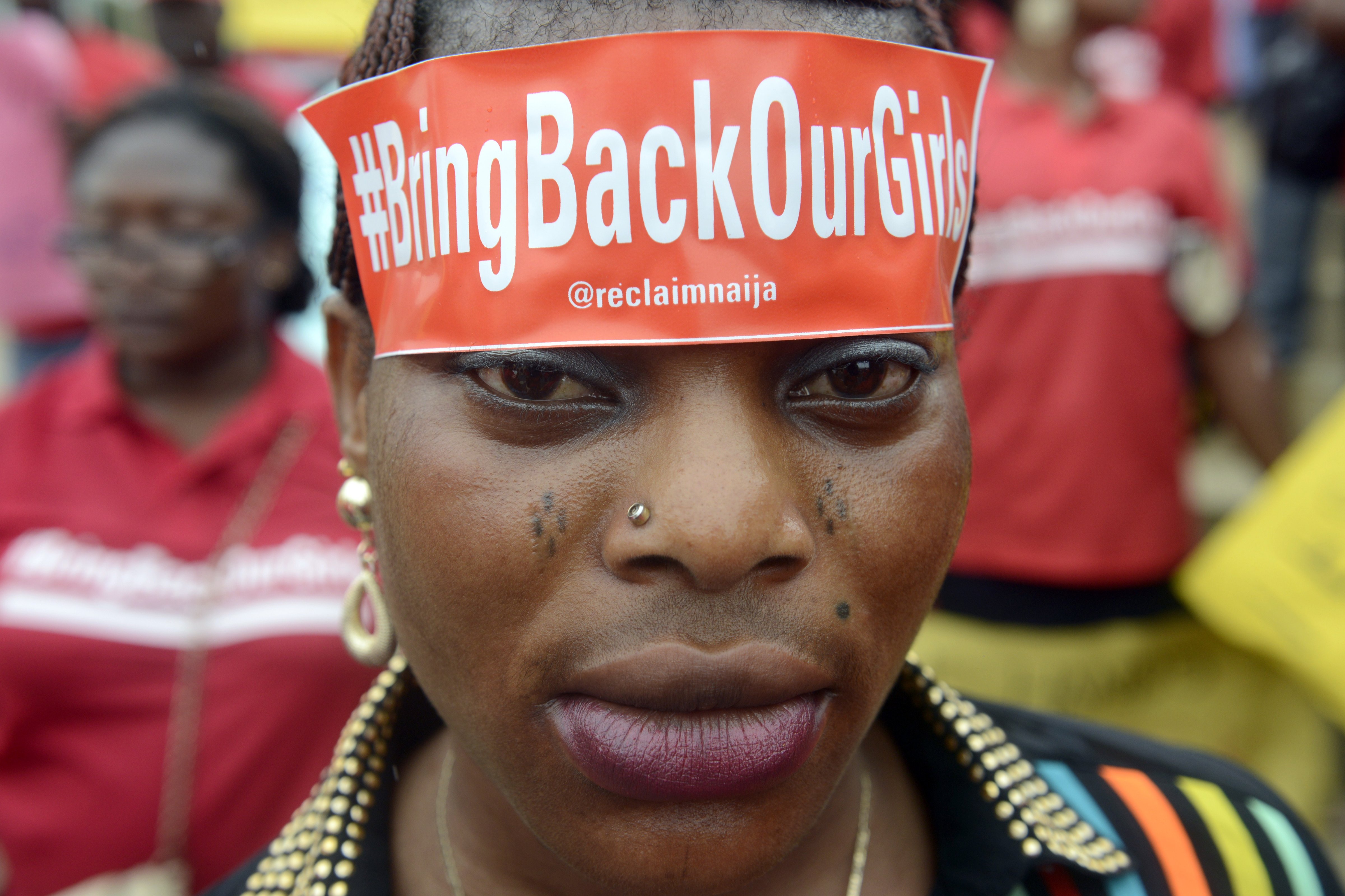 A woman with a sticker on her head bearing the slogan "Bring back our girls" marches for the release of the more than 200 abducted Chibok school girls in Lagos, Nigeria on May 29, 2014. (Pius Utomi Ekpei—AFP/Getty Images)