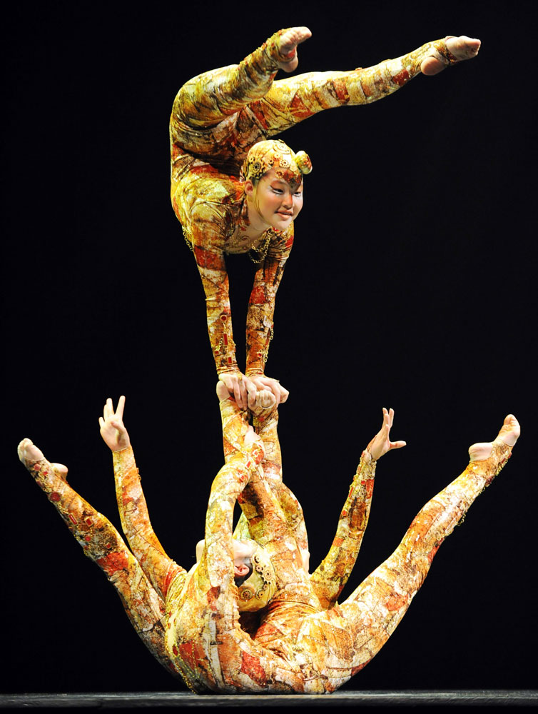 Performers contort their bodies during t