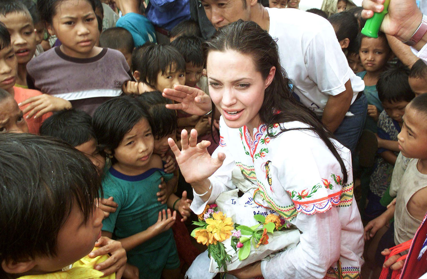 American actress Angelina Jolie (C) receives gifts