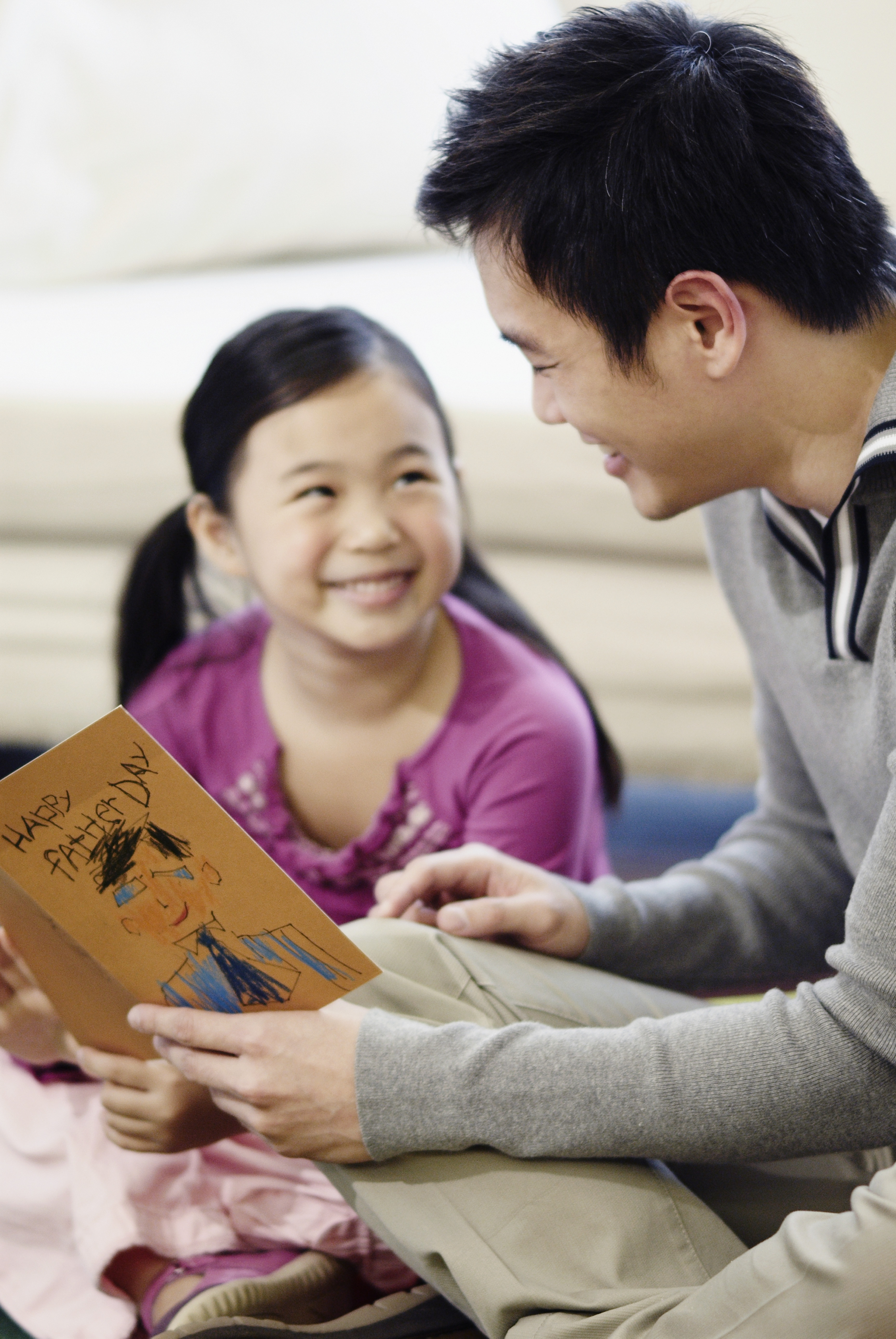 Girl Giving Dad Father's Day Card (Fuse&amp;mdash;Getty Images/Fuse)