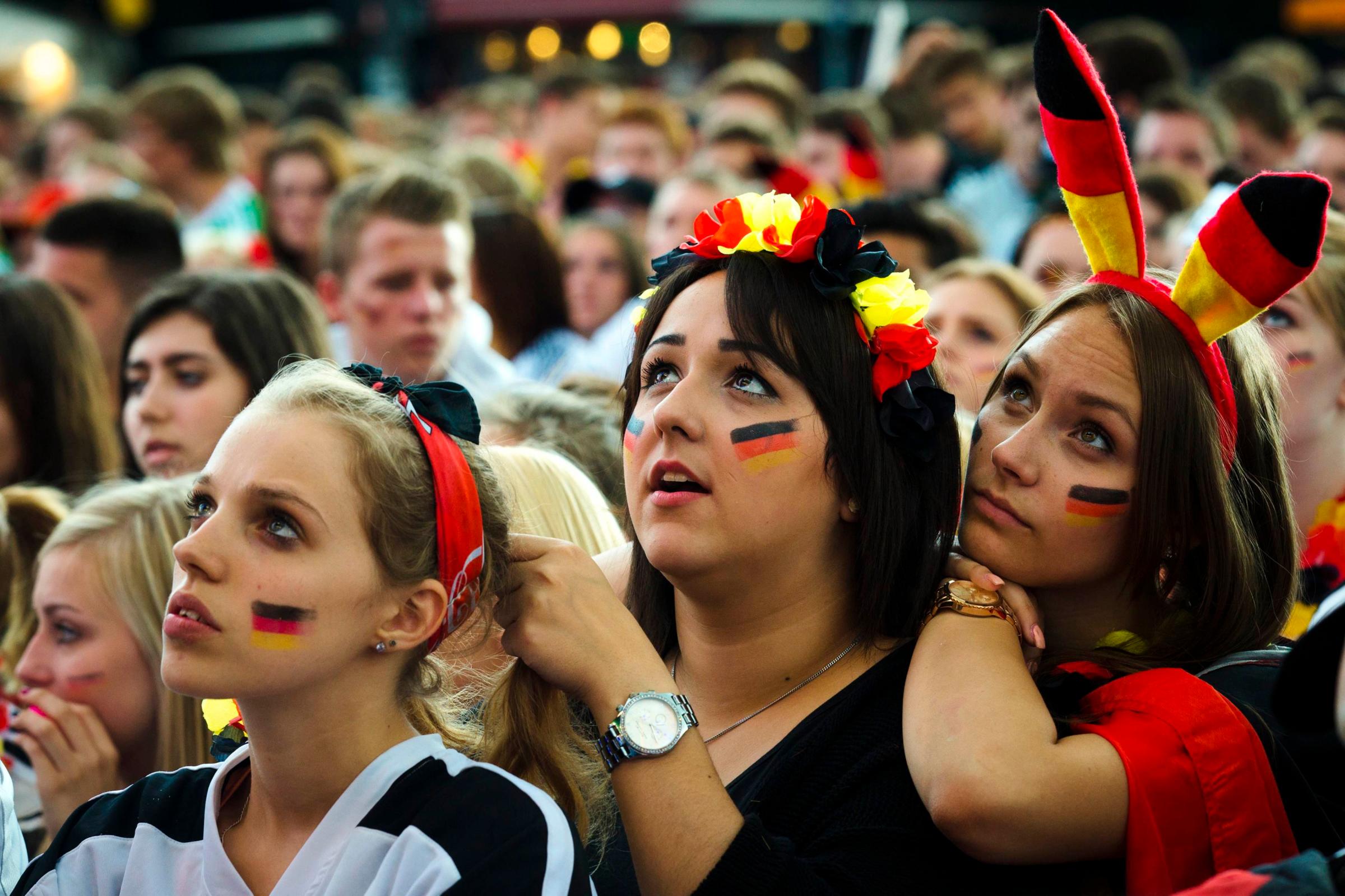 German fans watch as their team play against the U.S. at the Fanmeile public viewing arena in Berlin on June 26, 2014.