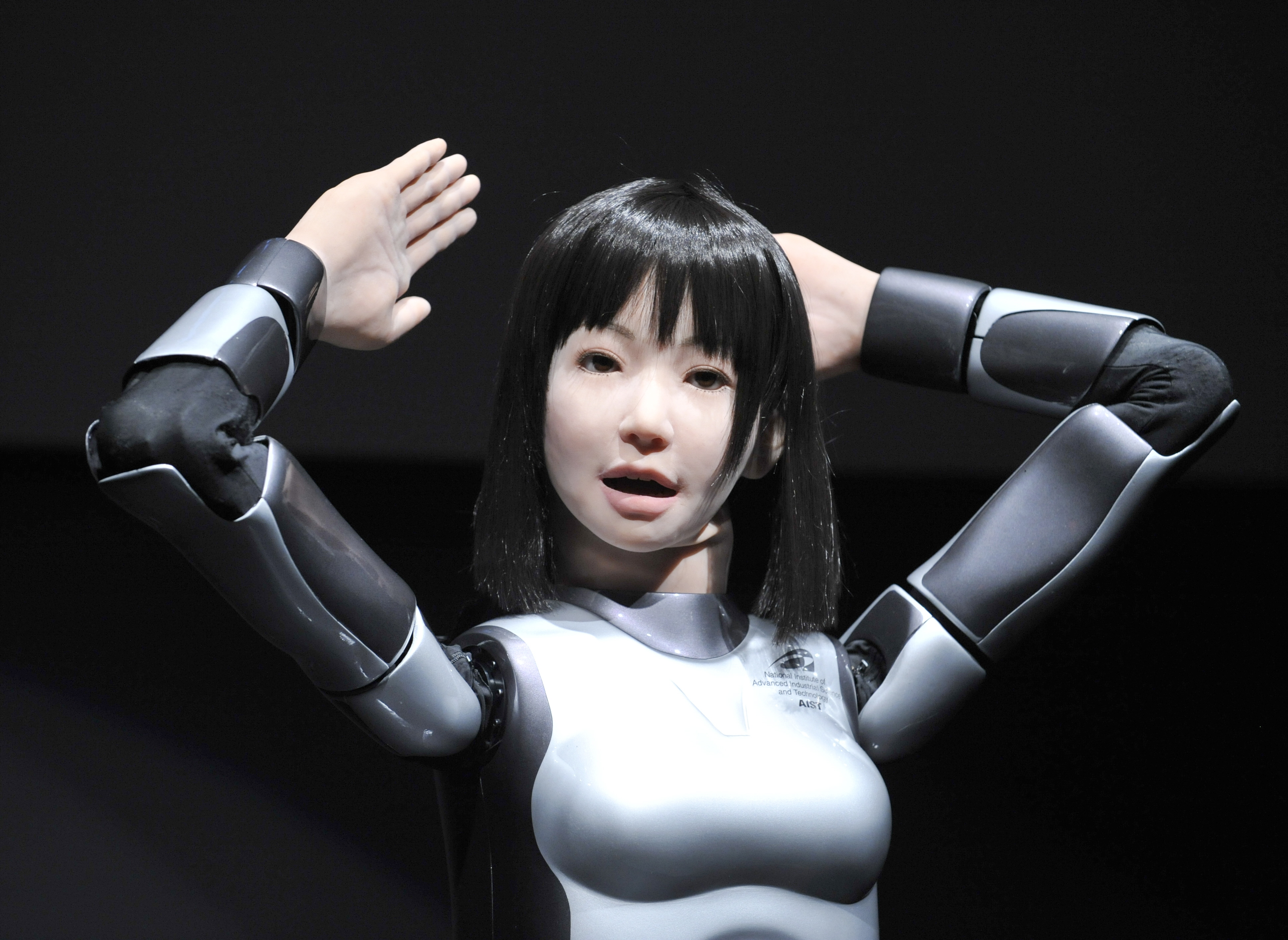 A humanoid robot, HRP-4C, developed by Japan's Advanced Industrial Science and Technology shows off her skills during the Digital Contents Expo in Tokyo on October 22, 2009.