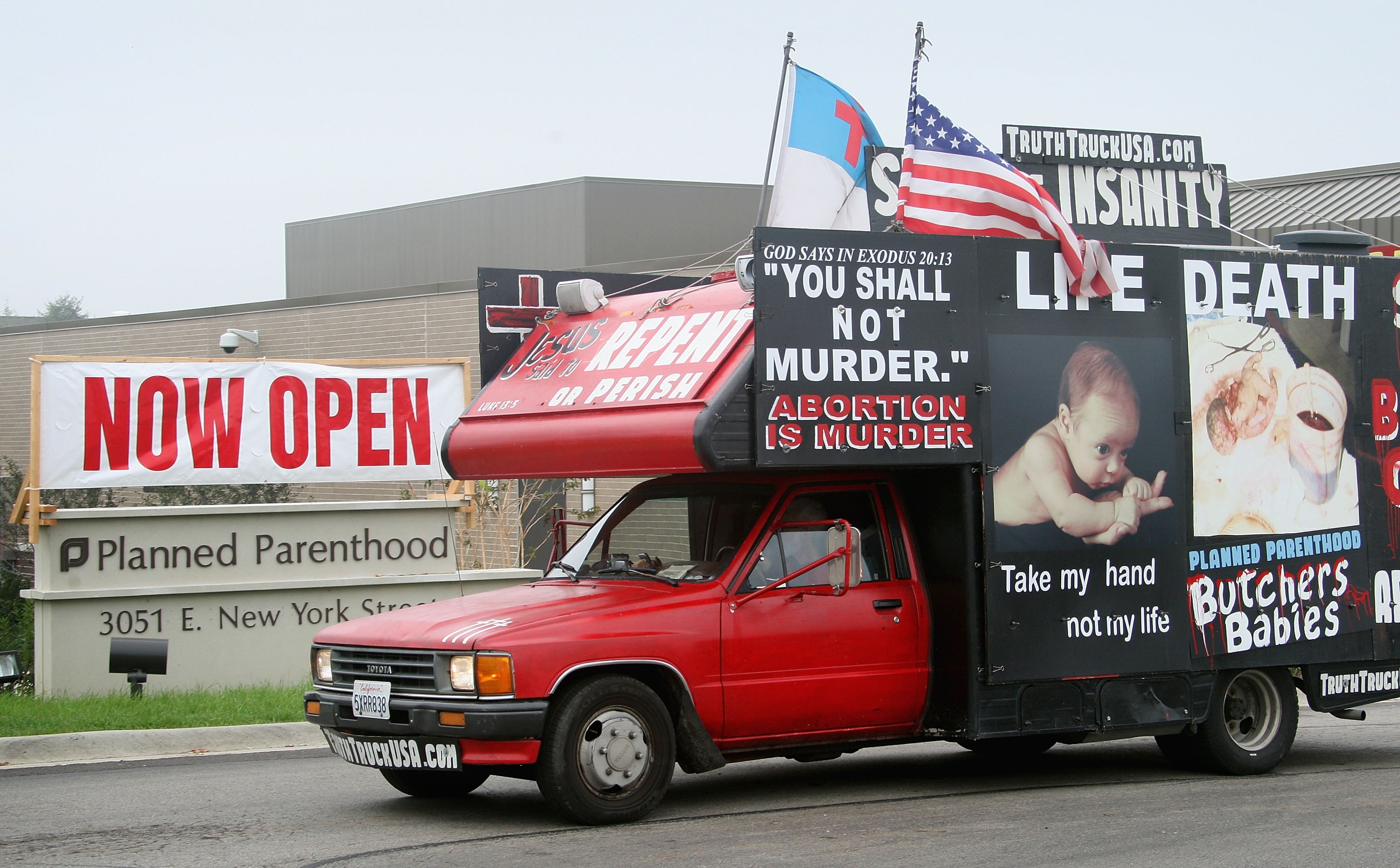 A truck covered with anti-abortion messages is used to protest the opening of a Planned Parenthood clinic in Aurora, Ill., on Oct. 2, 2007. (Scott Olson—Getty Images)