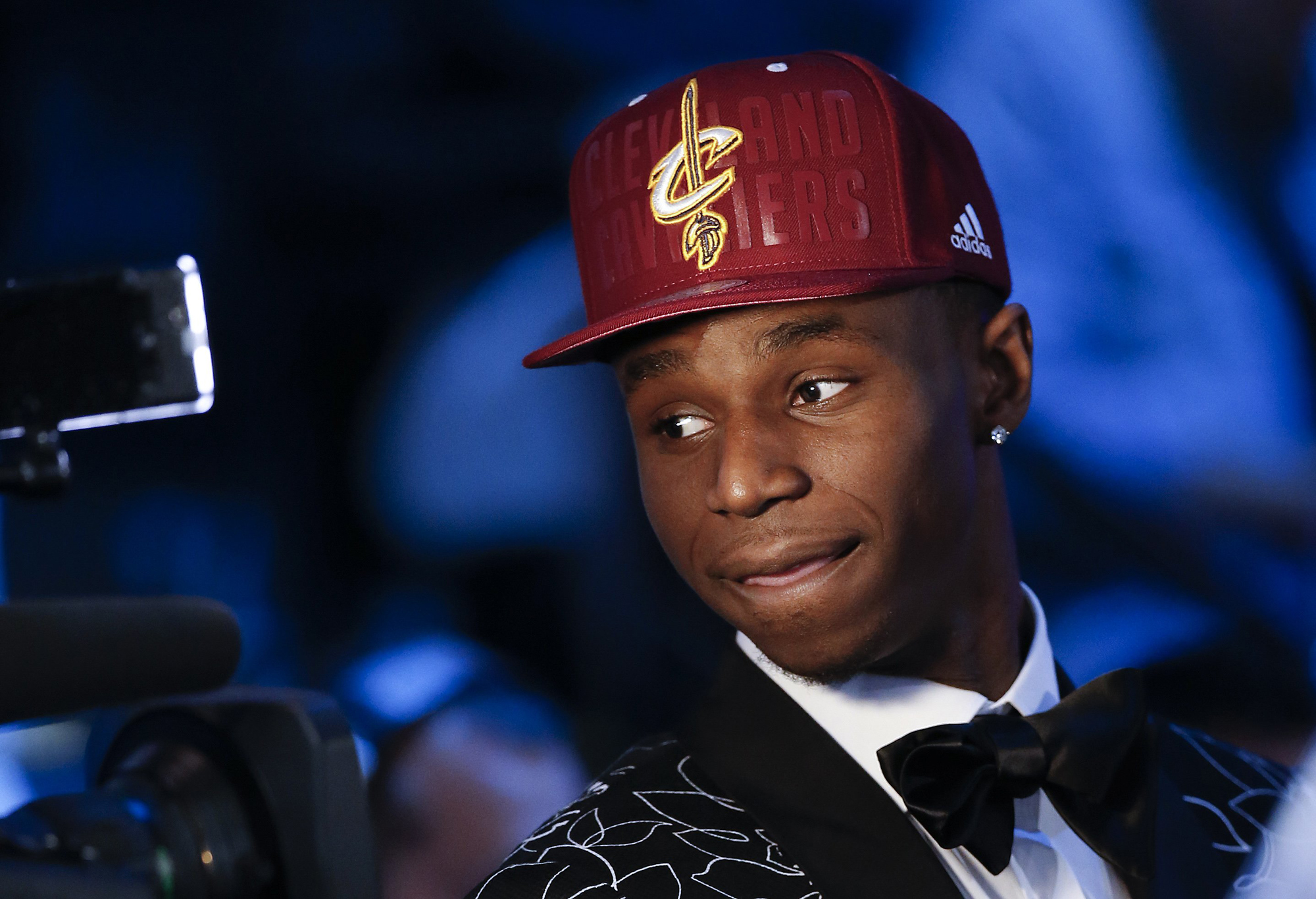 Andrew Wiggins of Kansas stops for a television interview after being selected by the Cleveland Cavaliers as the number one pick in the 2014 NBA draft, June 26, in New York.