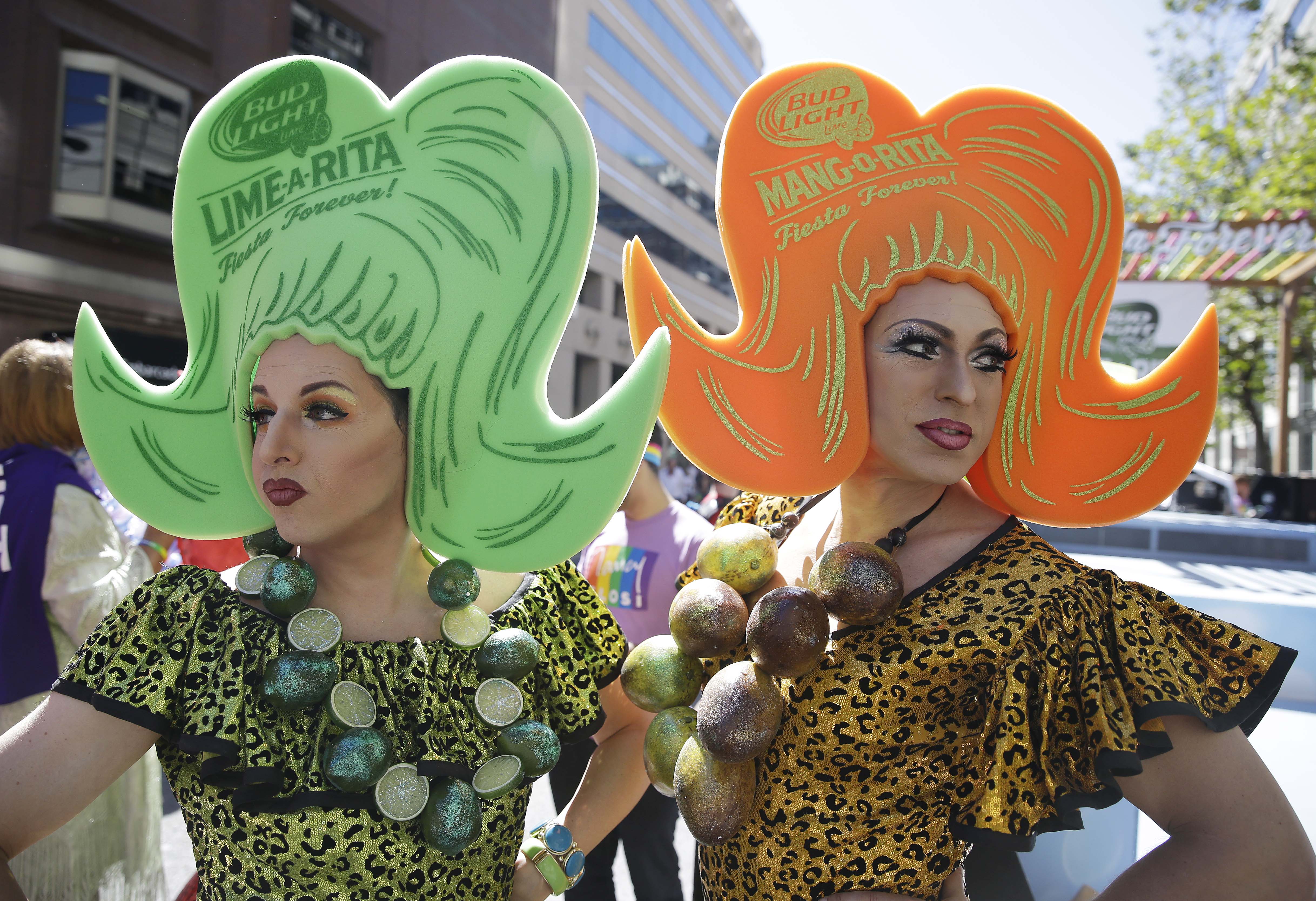 LeMay, left, dressed as Lime A Rita and Darcy Drollinger, right, dressed as Mang O Rita, wait by their float for the start of the 44th annual San Francisco Gay Pride parade Sunday, June 29, 2014, in San Francisco.