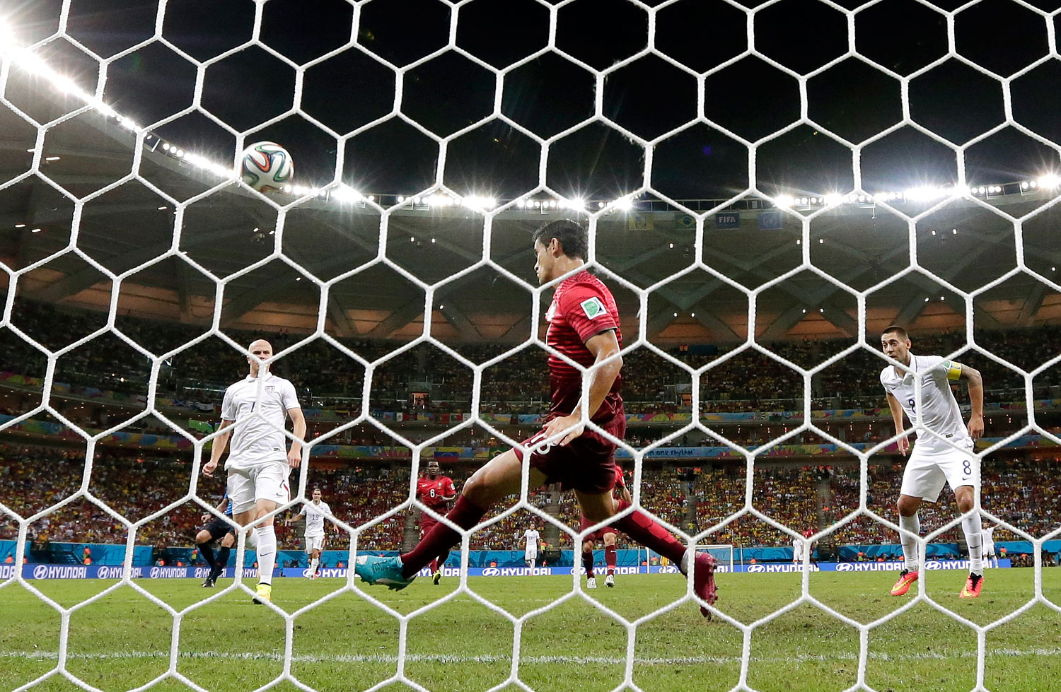 Portugal's Ricardo Costa deflects a ball before it crosses the line.