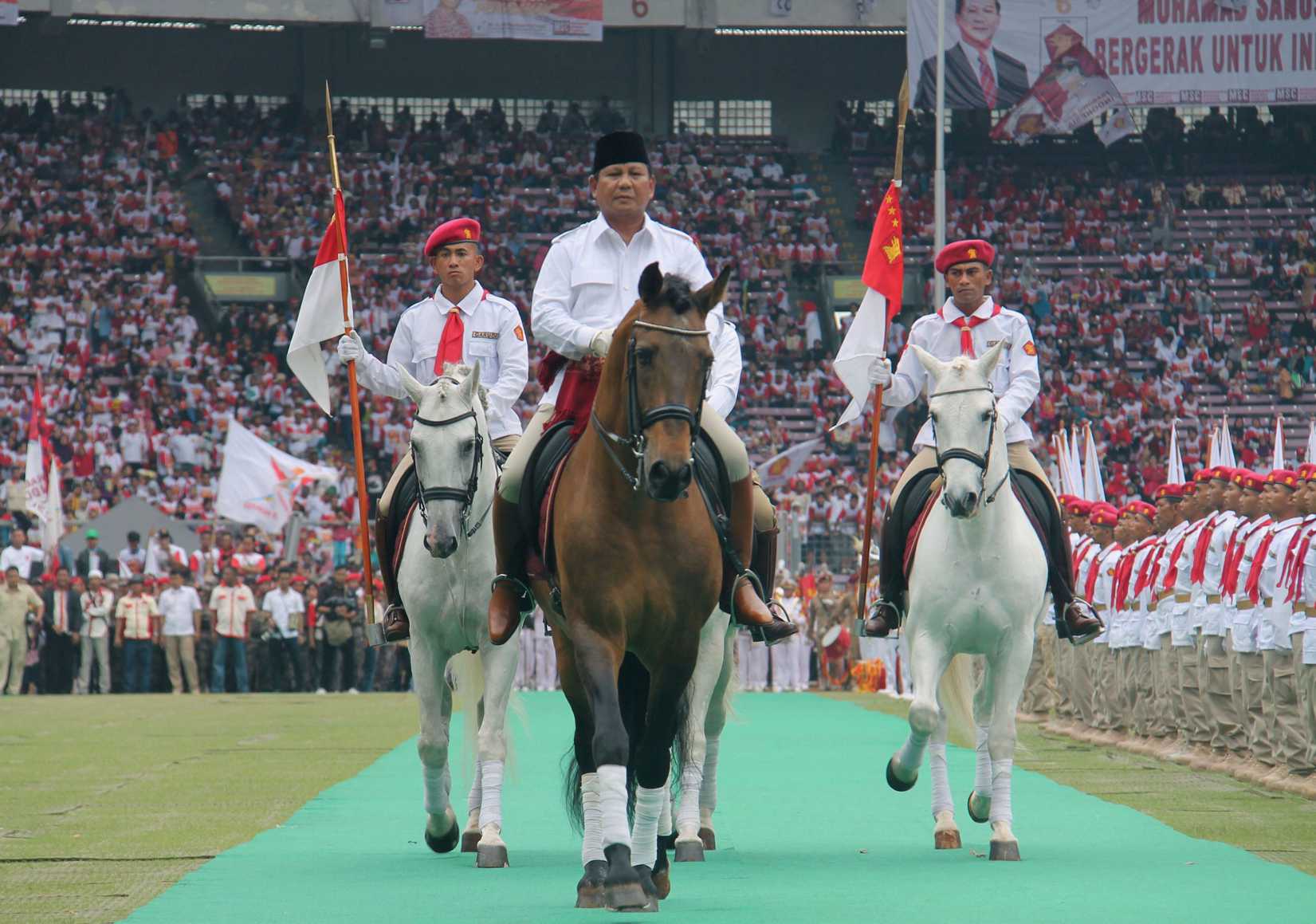 Retired general Prabowo Subianto rides a horse at a stadium in Jakarta during a campaign rally of the Gerindra party on March 23, 2014 (Kyodo / AP)