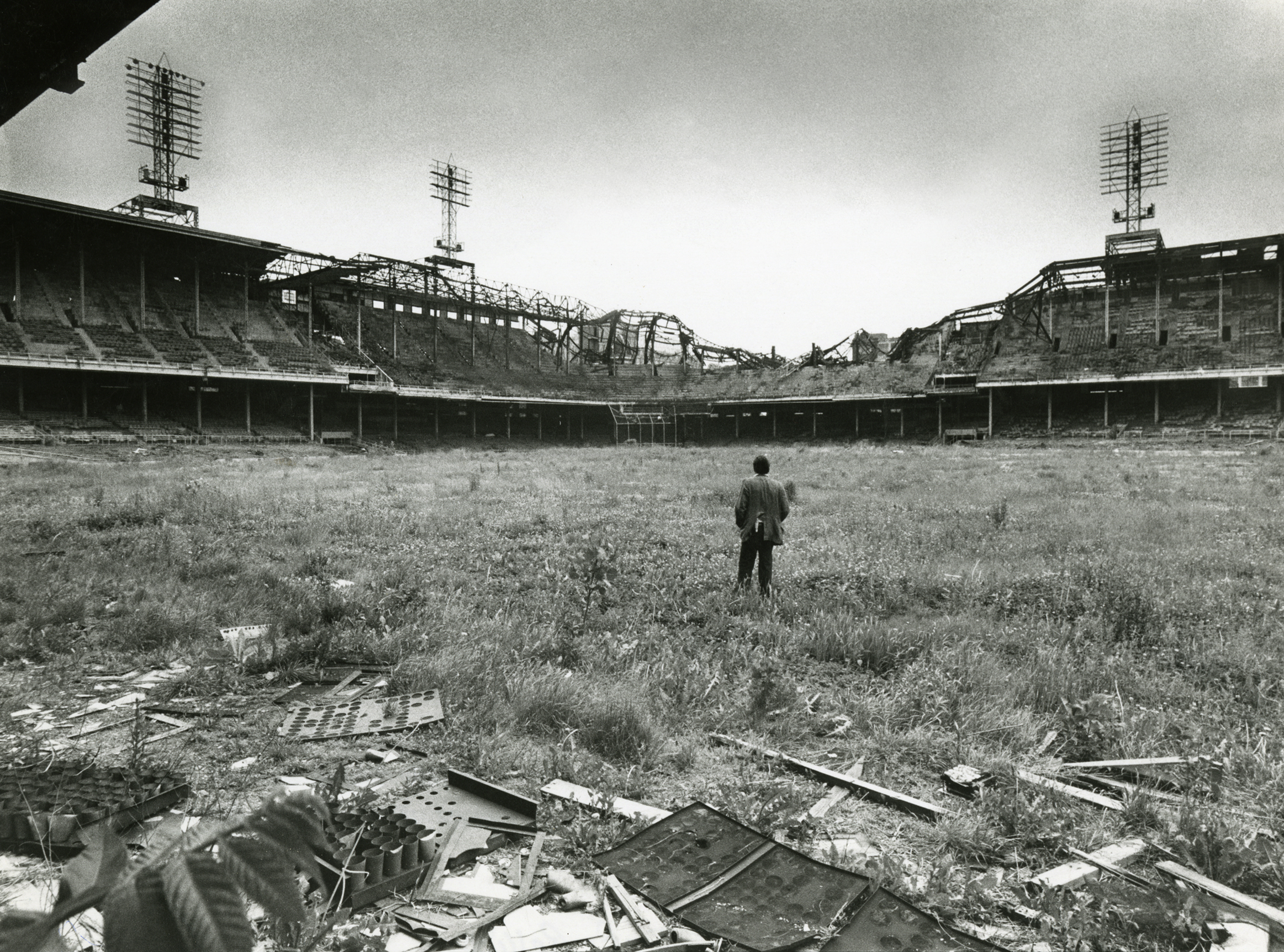 Photographer Bob Bartosz takes a self-portrait amidst the weeds, debris and ruins of Philadelphia's abandoned Connie Mack Stadium, 65 years after it opened as Shibe Park and nearly four years after it hosted its final big league game, June 1974.