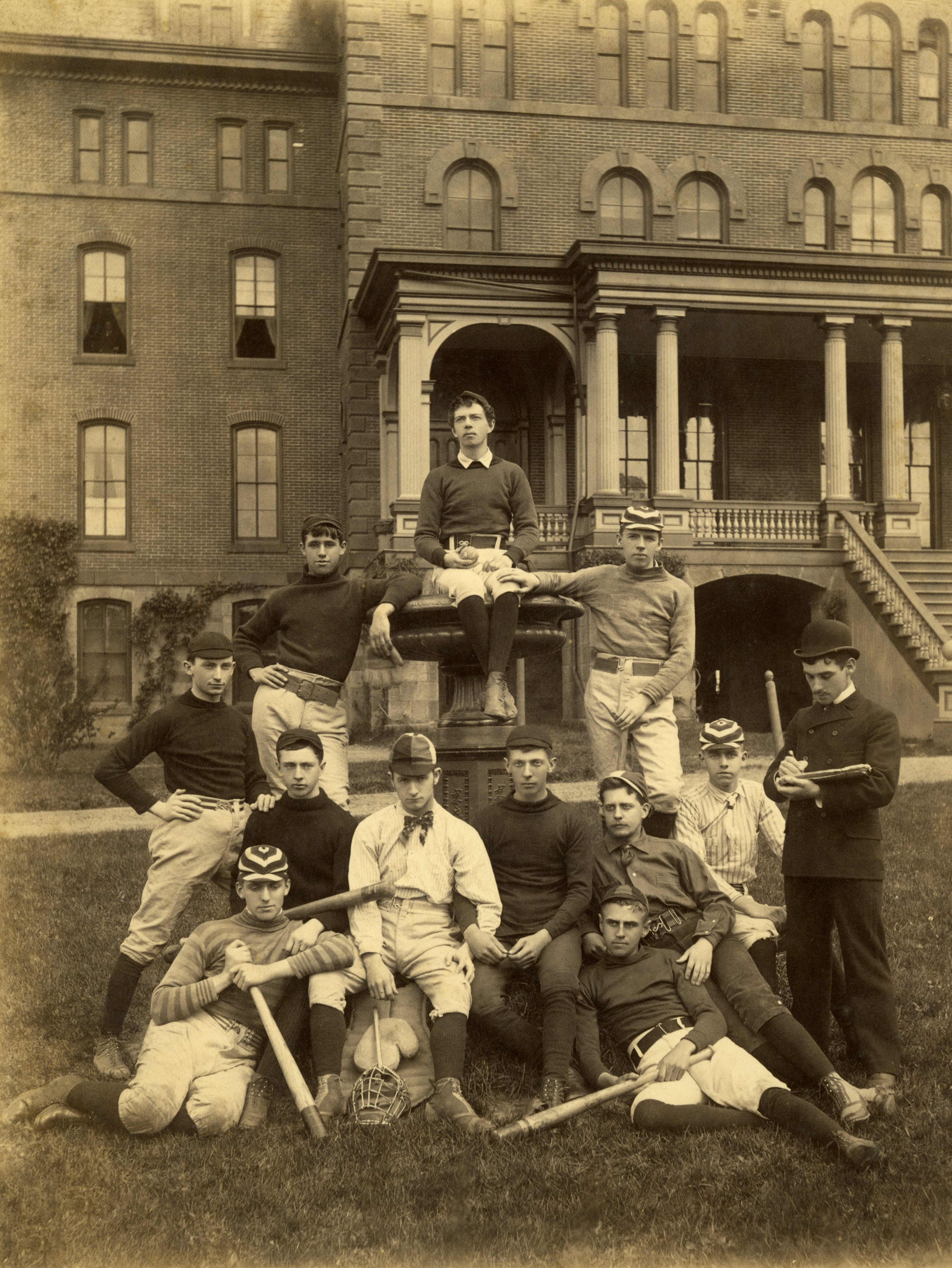 Members of a baseball team at Peddie Institute, a private boarding school in Hightstown, N.J., gather for a group photograph in front of the main school building, May 1891.